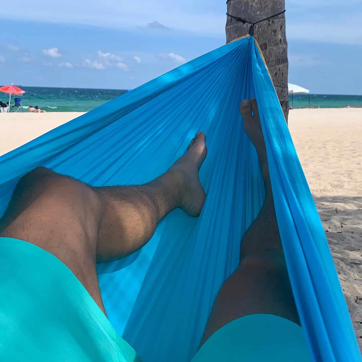 resting in a hammock by the beach
