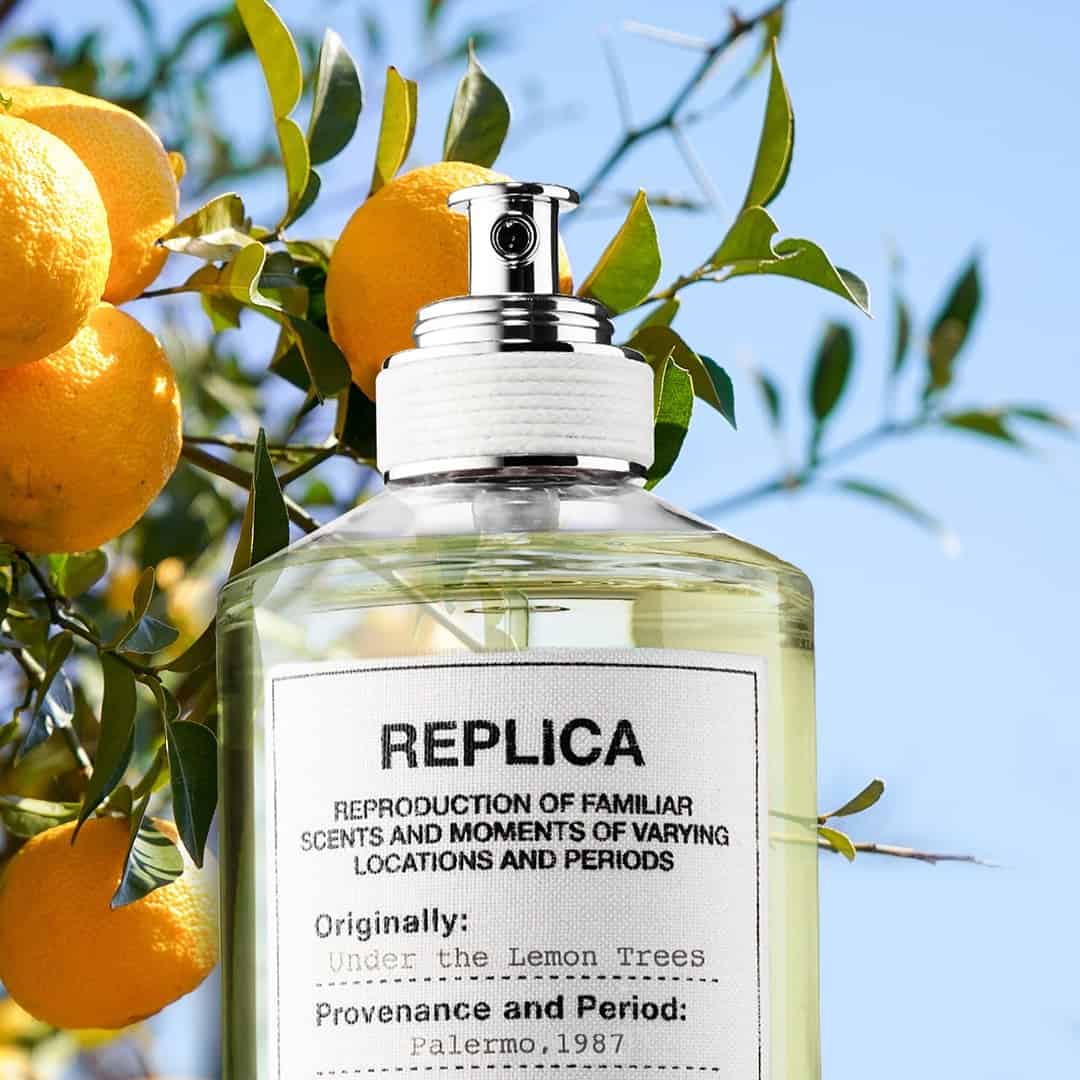 a bottle of maison margiela under the lemon trees