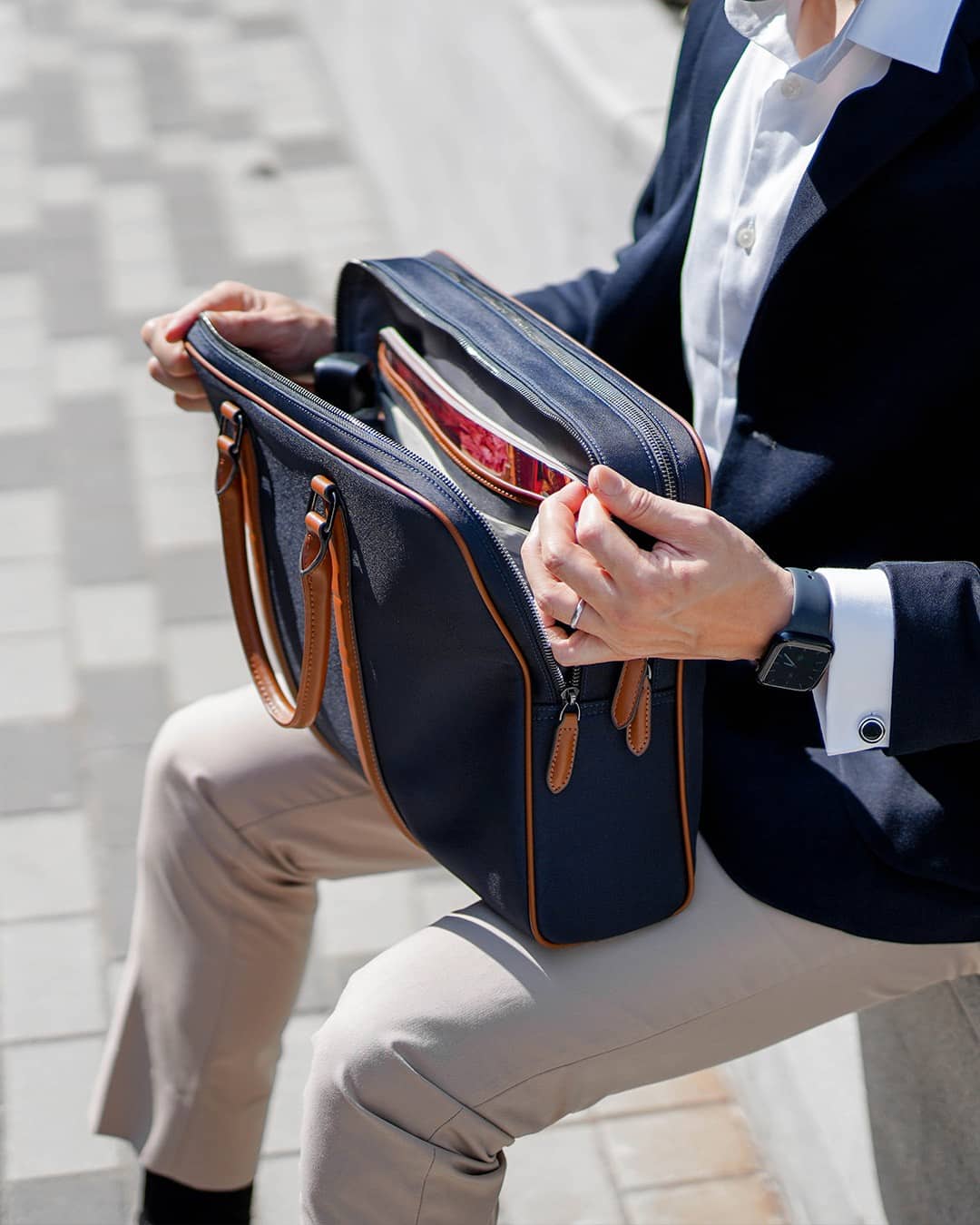 man opening a laptop bag