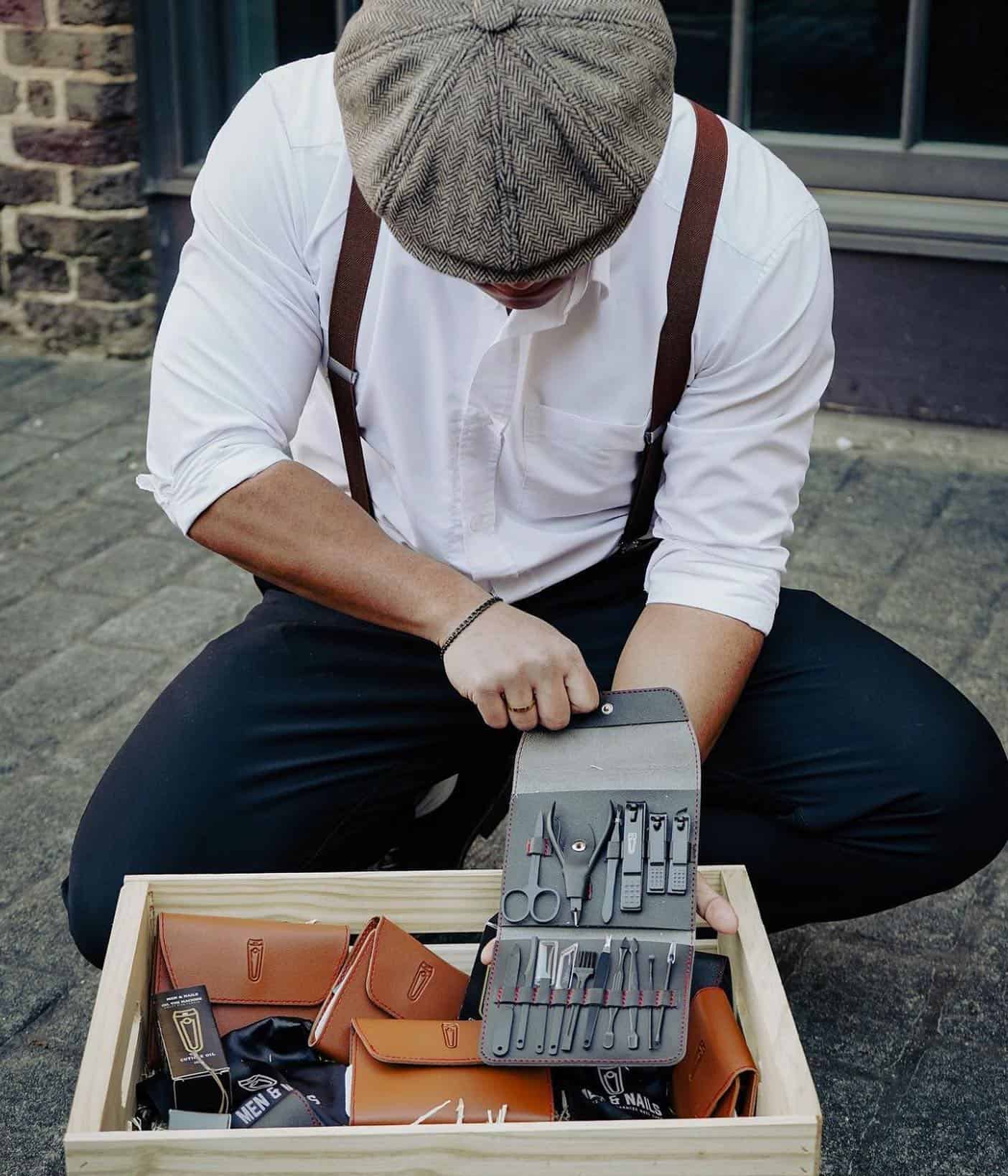 man showing a set of nail grooming tools