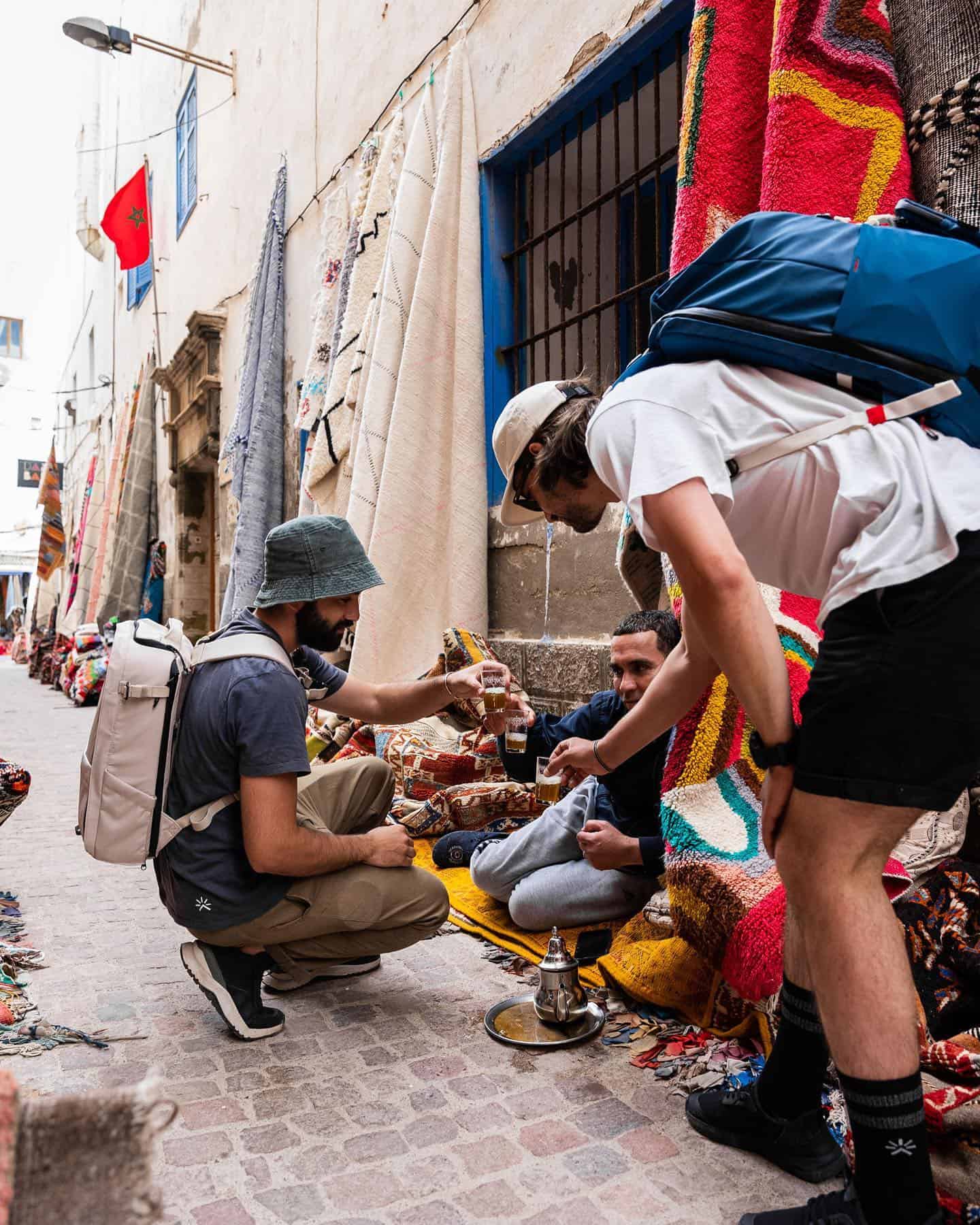 sharing tea with a textile vendor