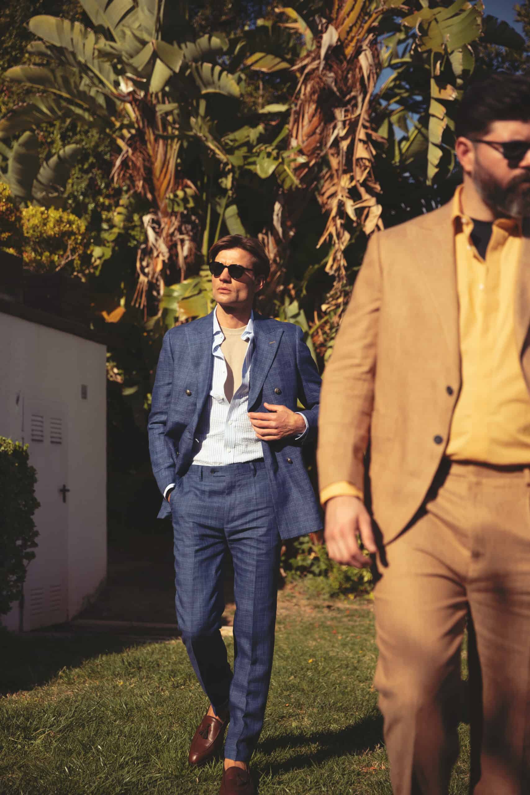 models wearing Hockerty bespoke suits in blue and tan