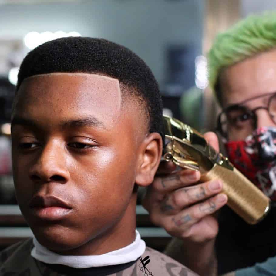 young man getting detailed with a babyliss clipper