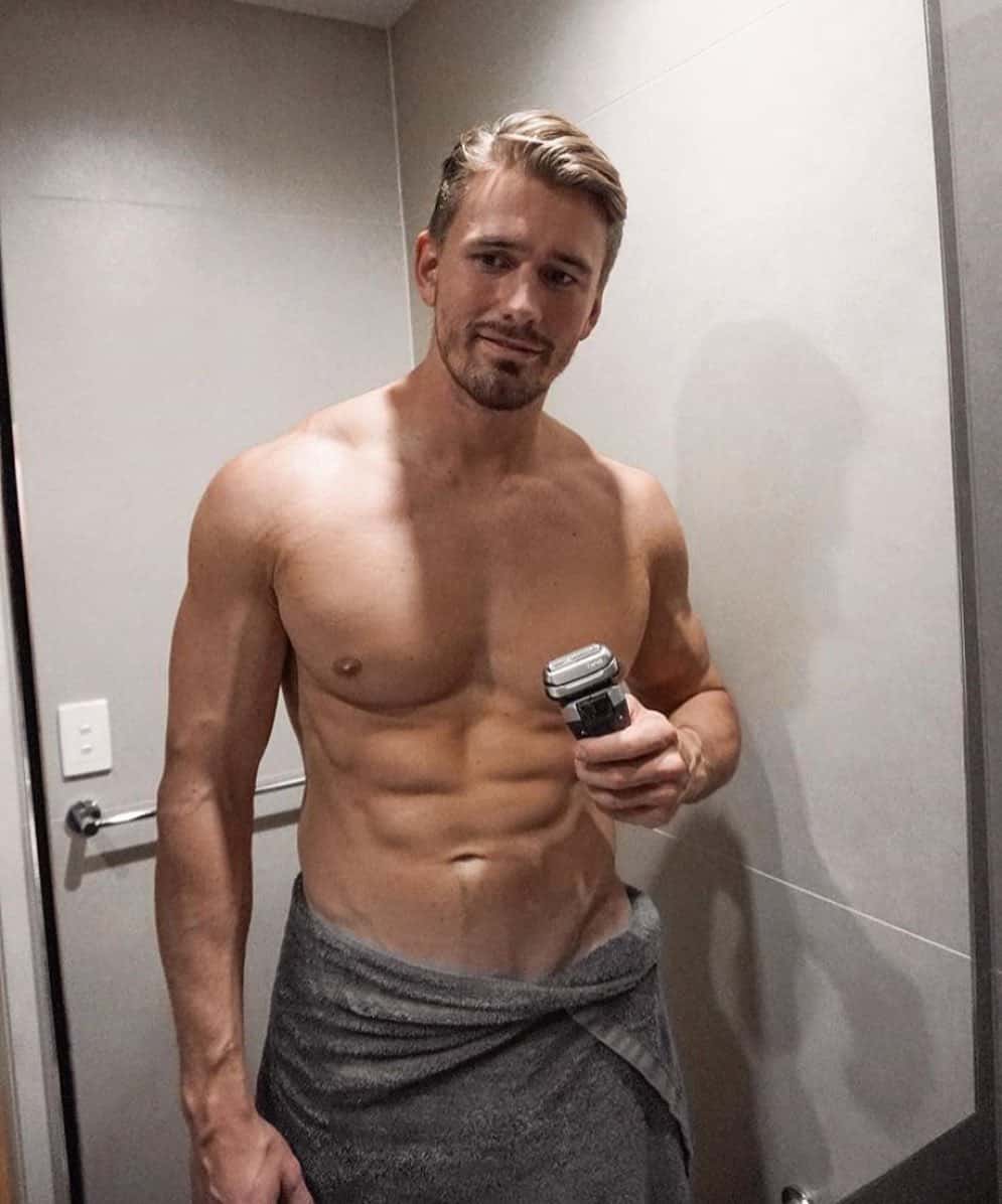 man holding an electric shaver by braun