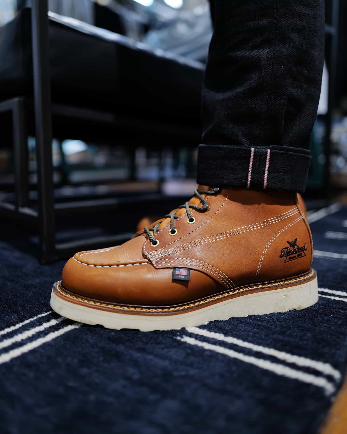 wearing a pair of thorogood moc toe boots