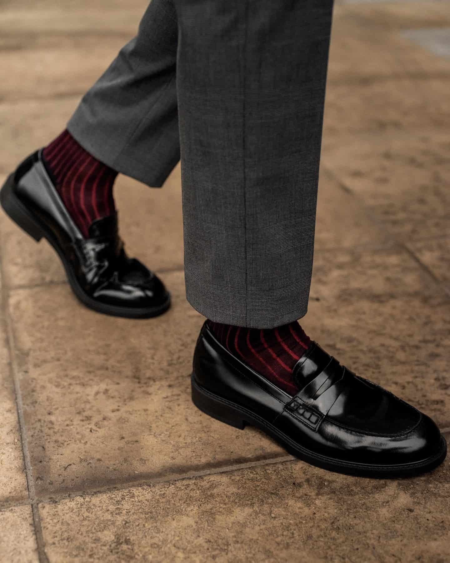 paring red socks with black loafers