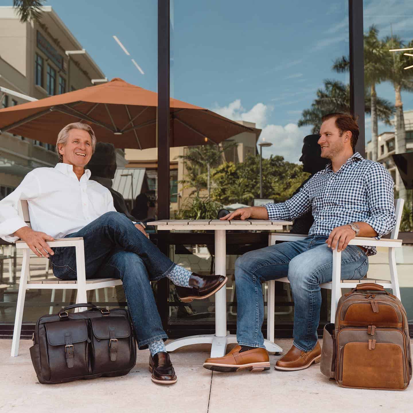 two men sitting at a table