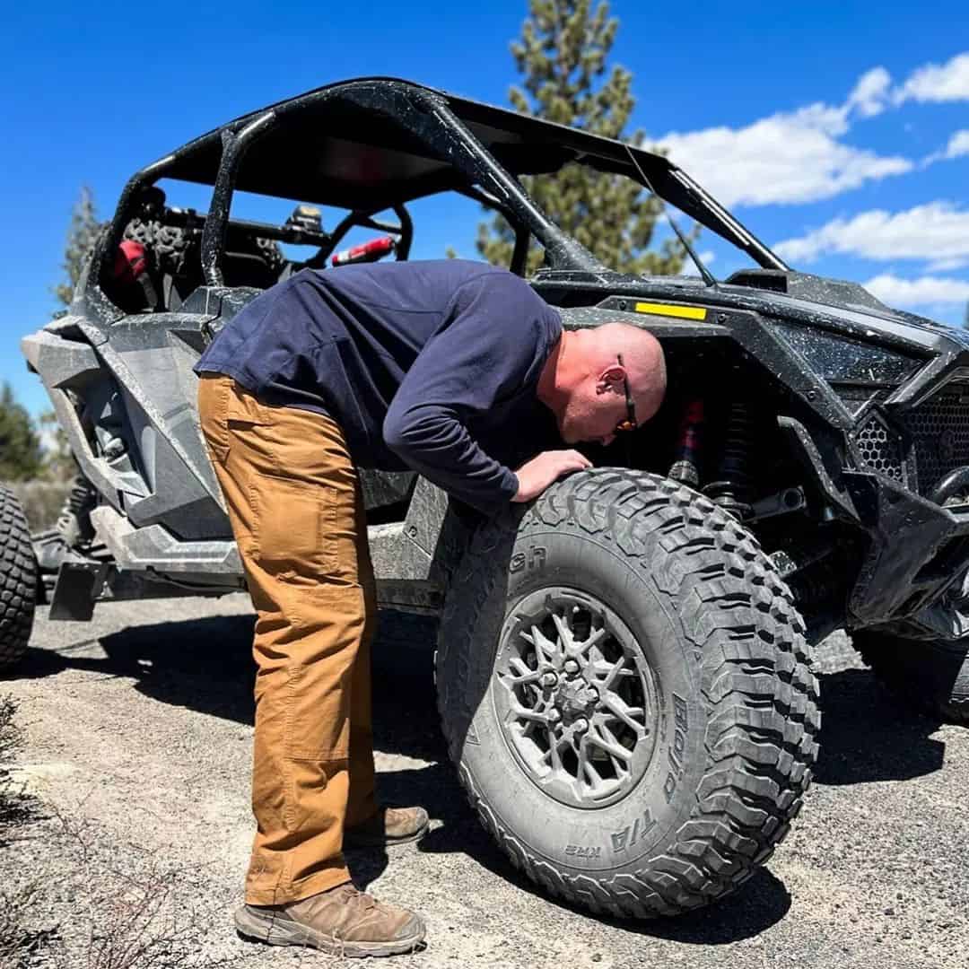 checkingthewheelsofanATV