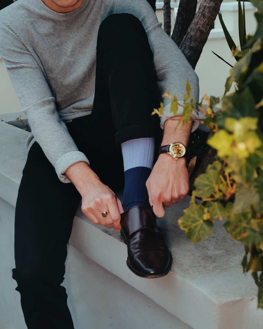 man putting on his shoes