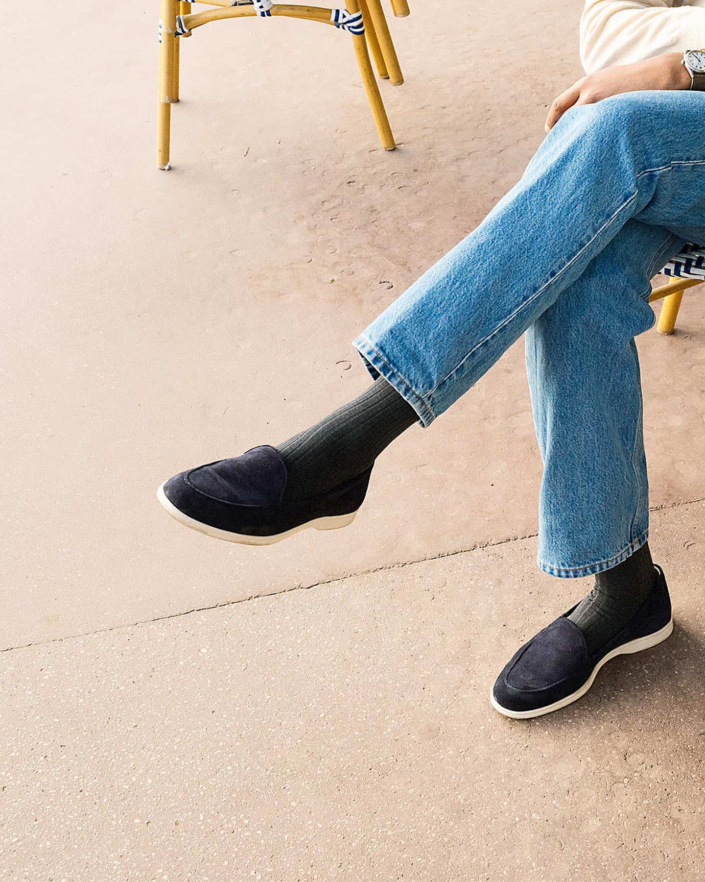 wearing a pair of navy suede loafers