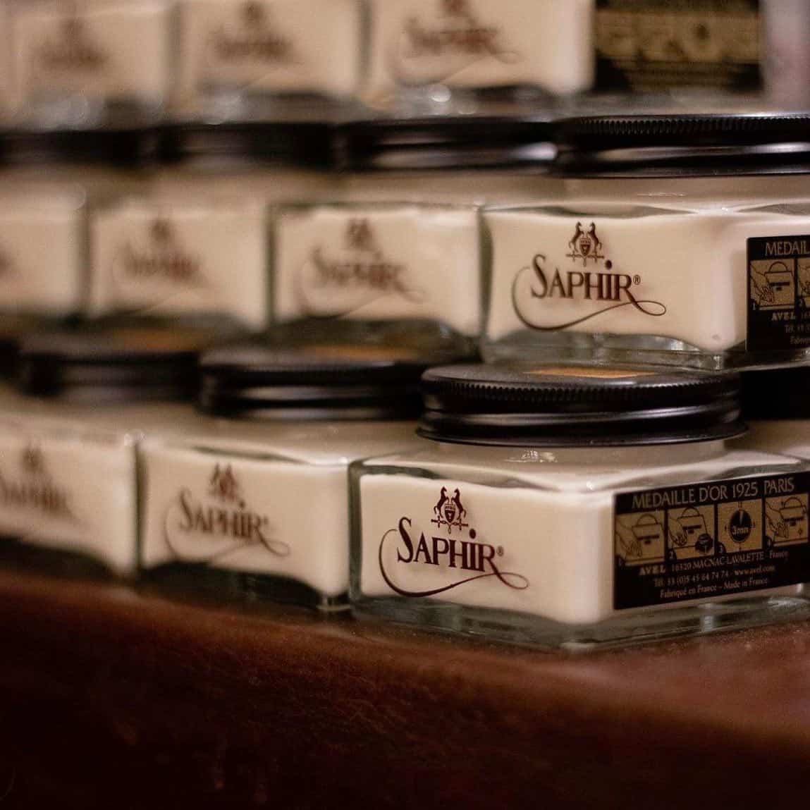 a stack of leather renovator by saphir