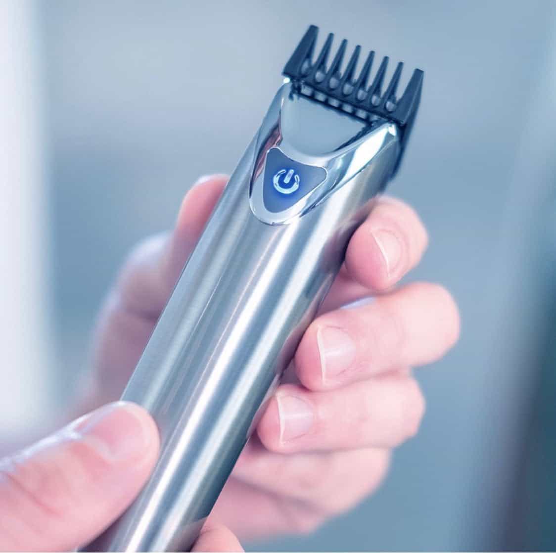 holding a wahl 9818 stainless steel groomer