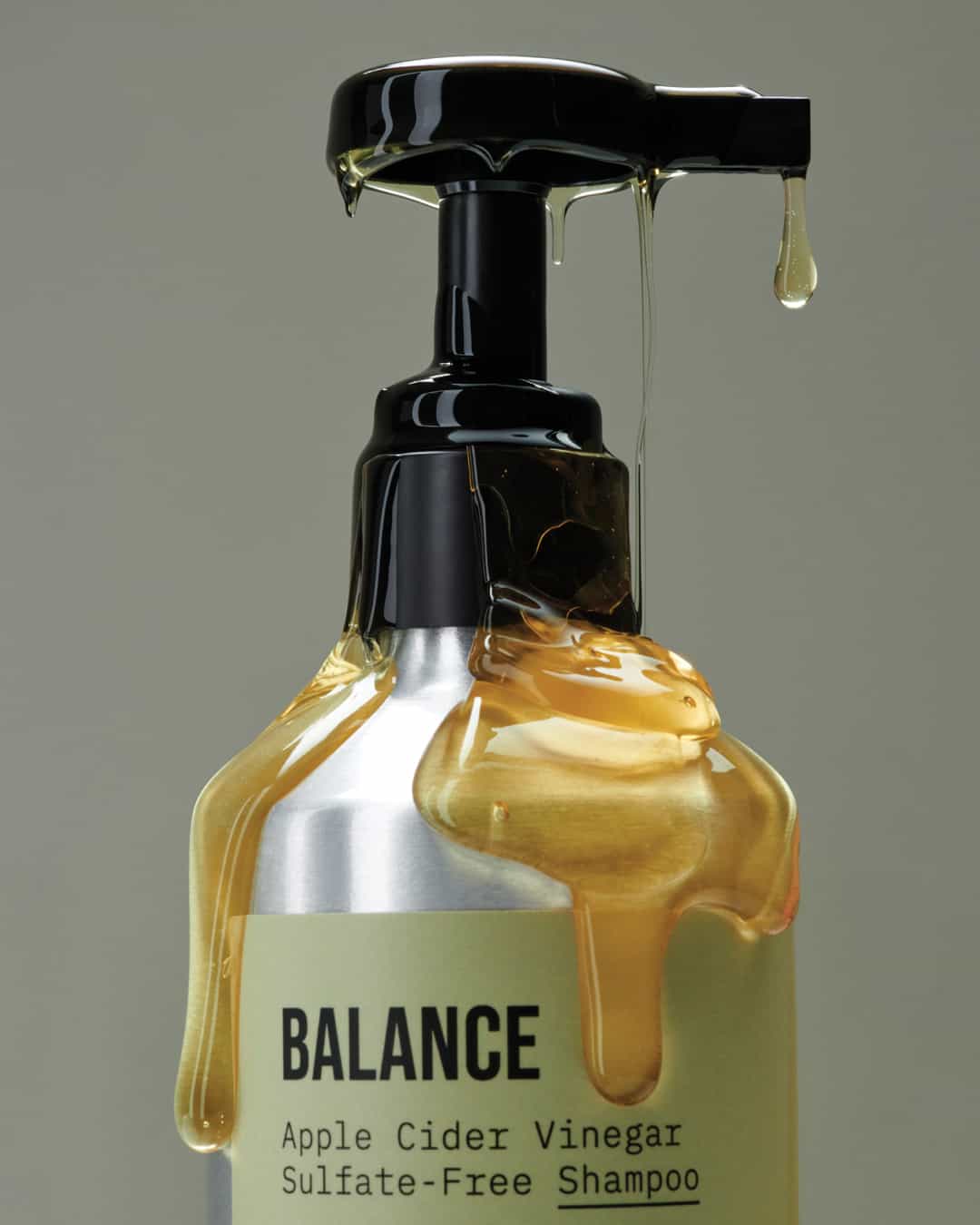 a bottle of Agcare balance natural shampoo with shampoo drippings