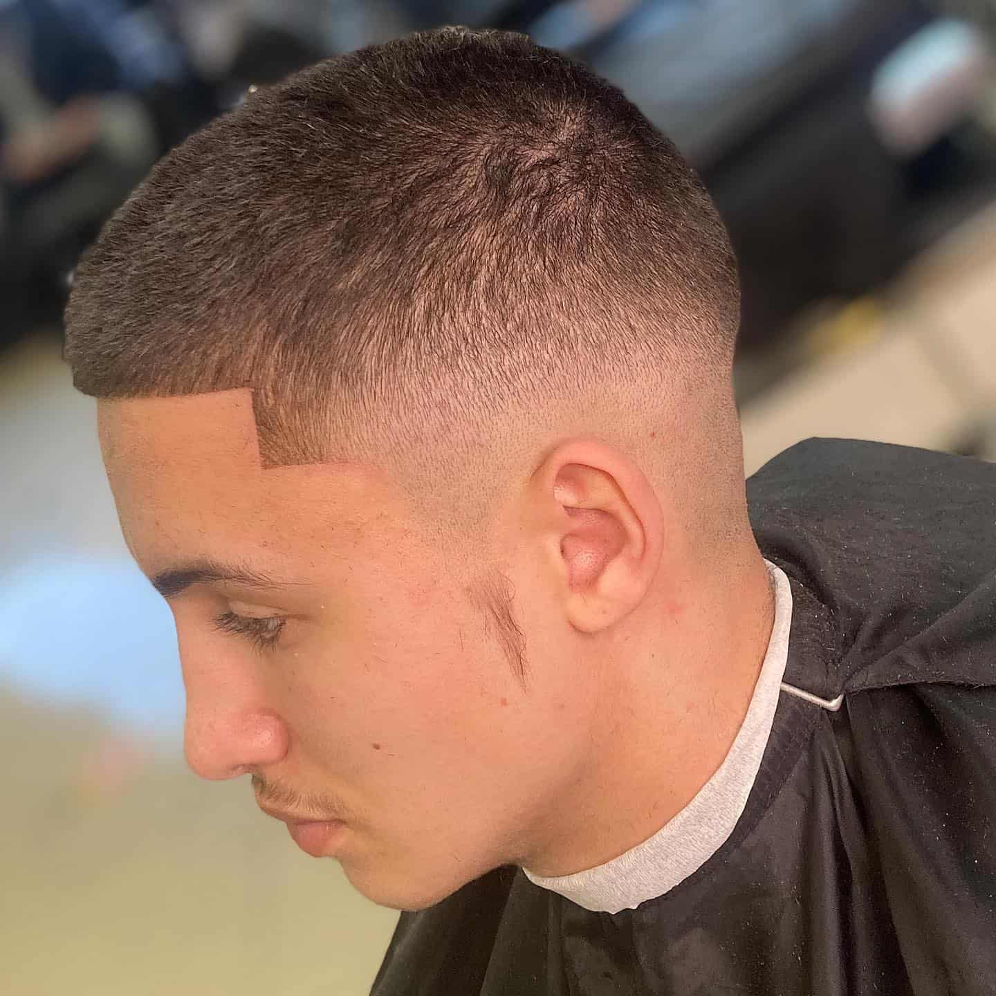 man getting the number 3 skin fade haircut