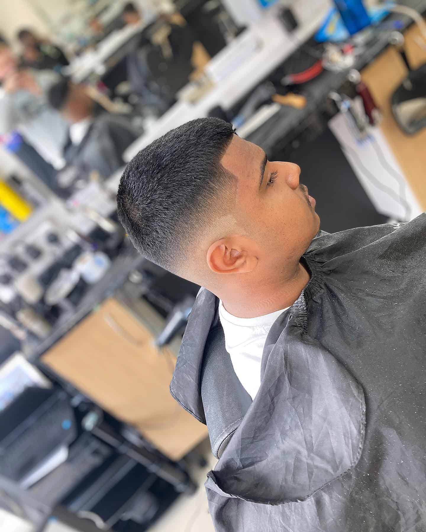 man getting the number 5 haircut with skin fade