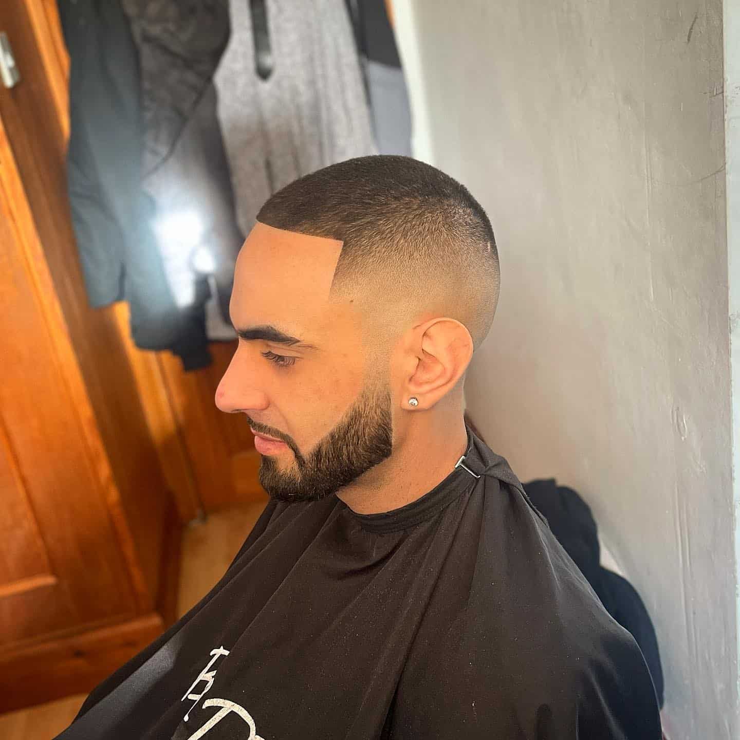 man with number 2 skin fade on top haircut