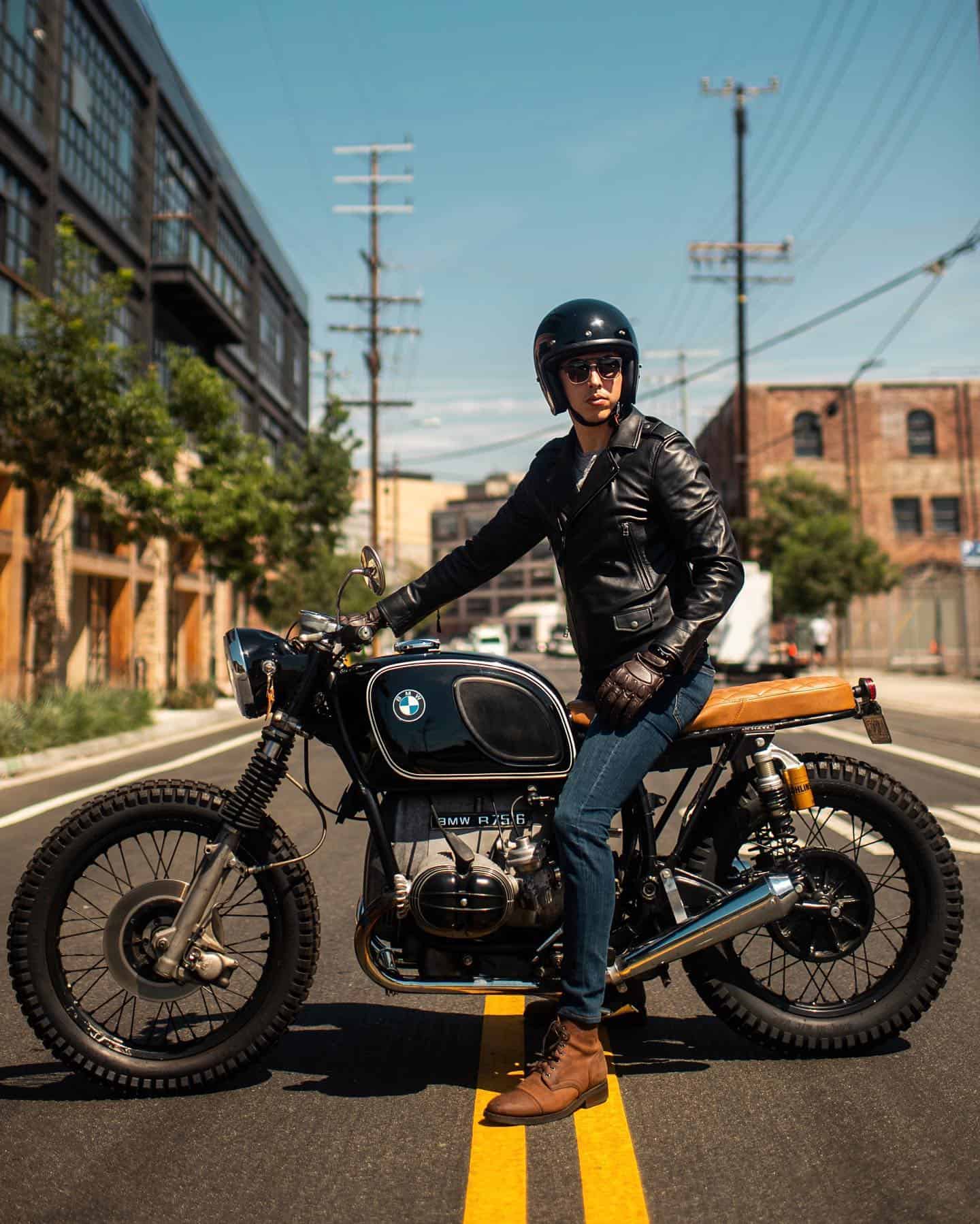 man riding a classic bmw motorcycle
