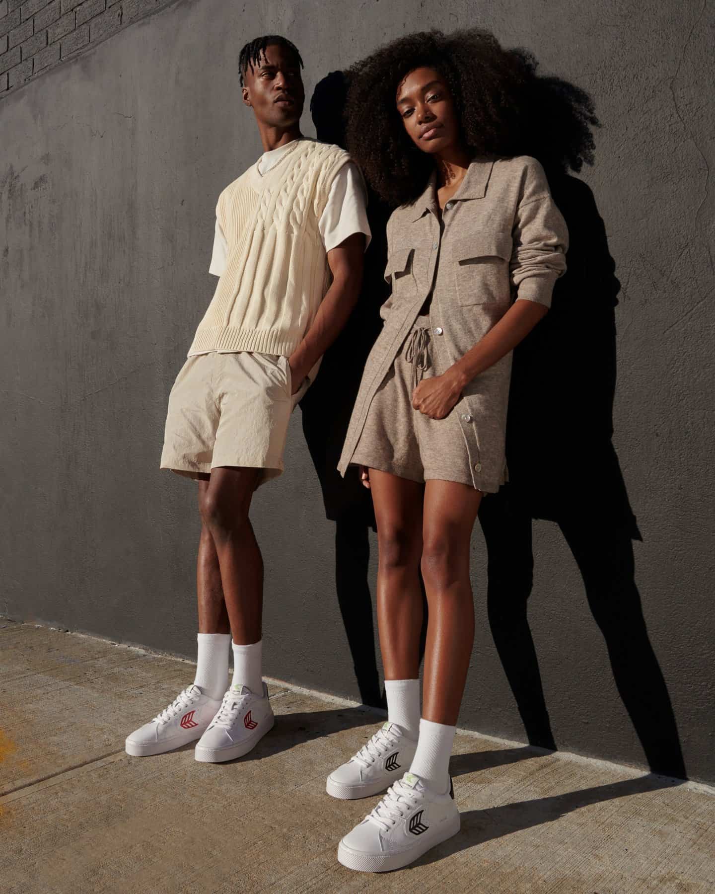 couple leaning on the wall