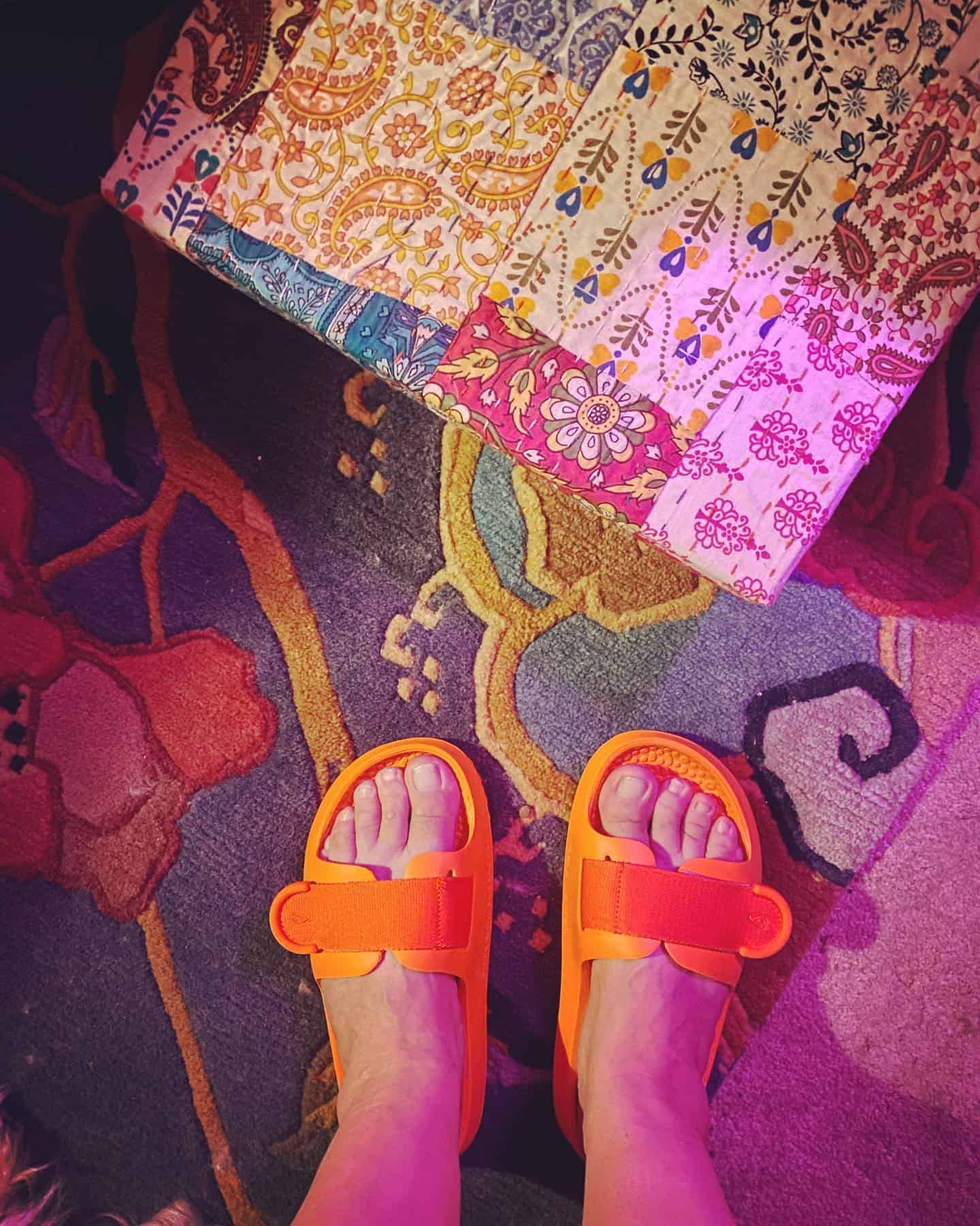 wearing a pair of sugar sliders by allbirds