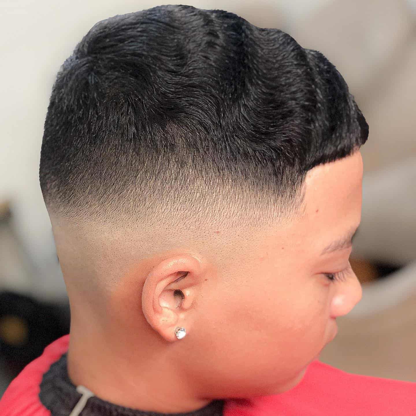 high skin fade number 4 haircut for wavy hair