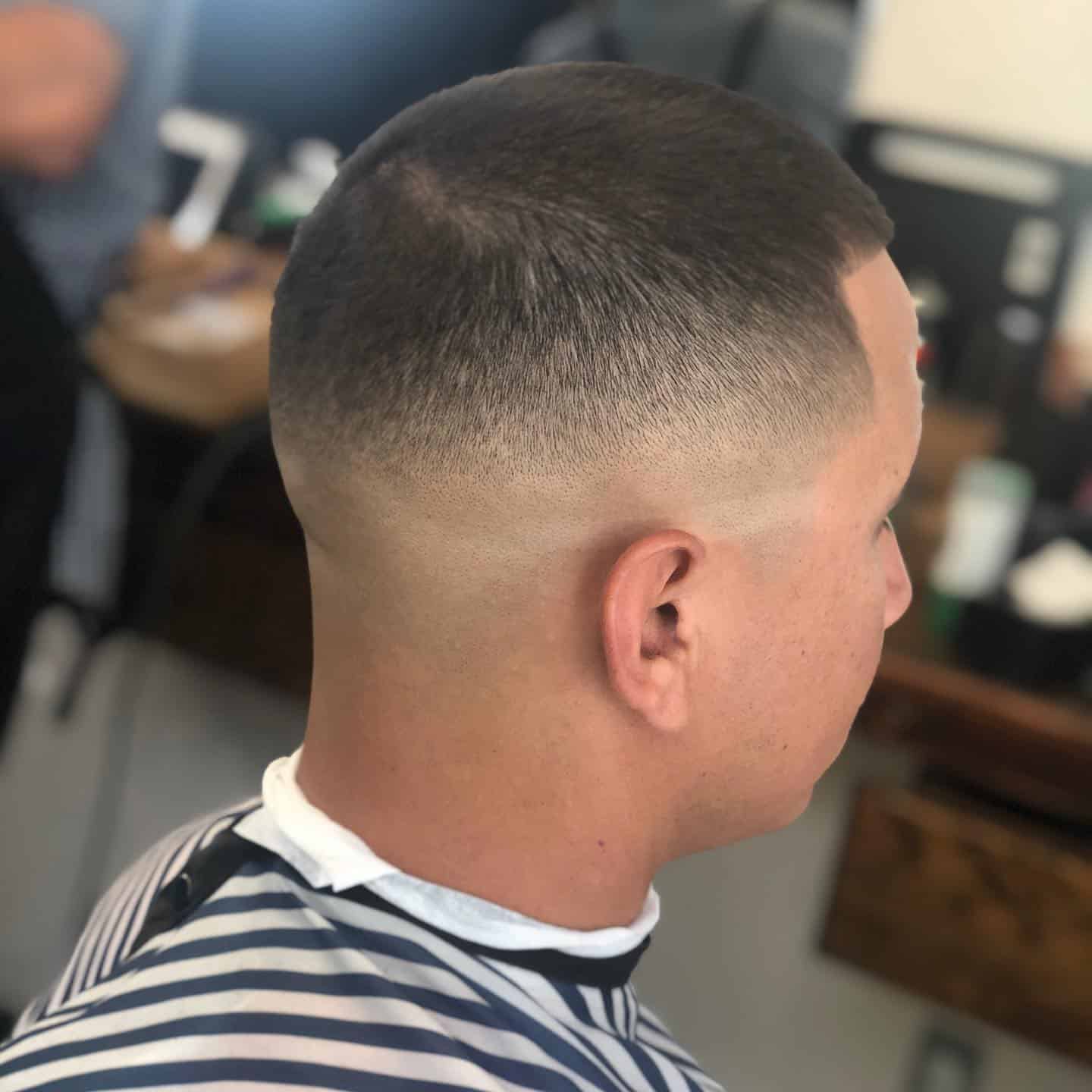 man with number 3 guard on top and high skin fade haircut
