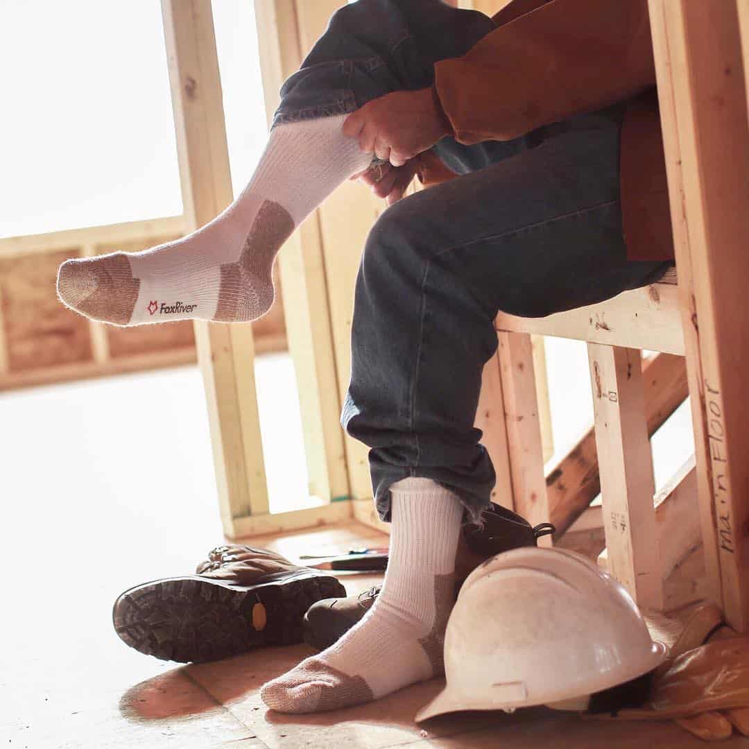 man wearing his work socks by fox river