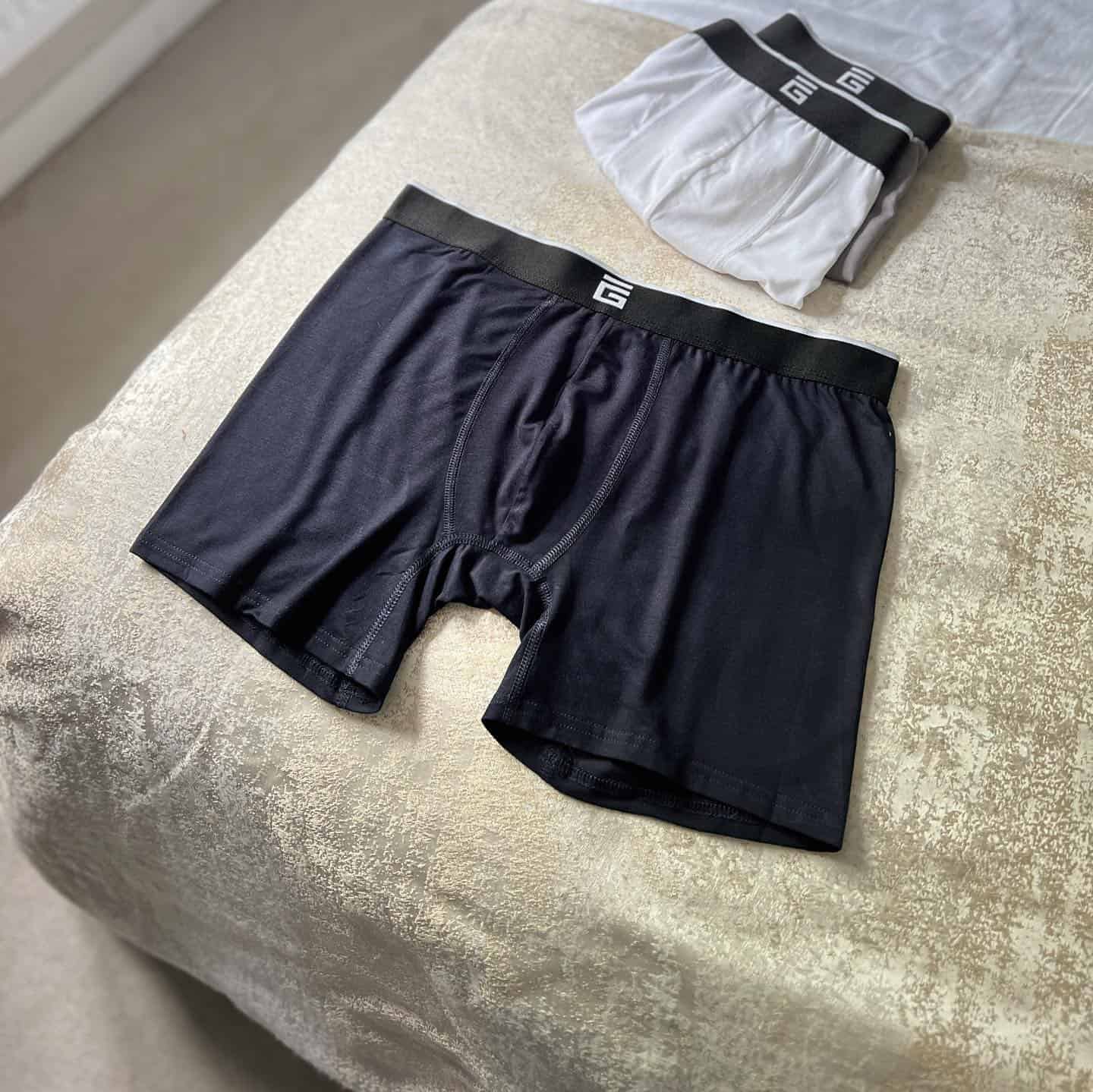 three boxer briefs on the bed