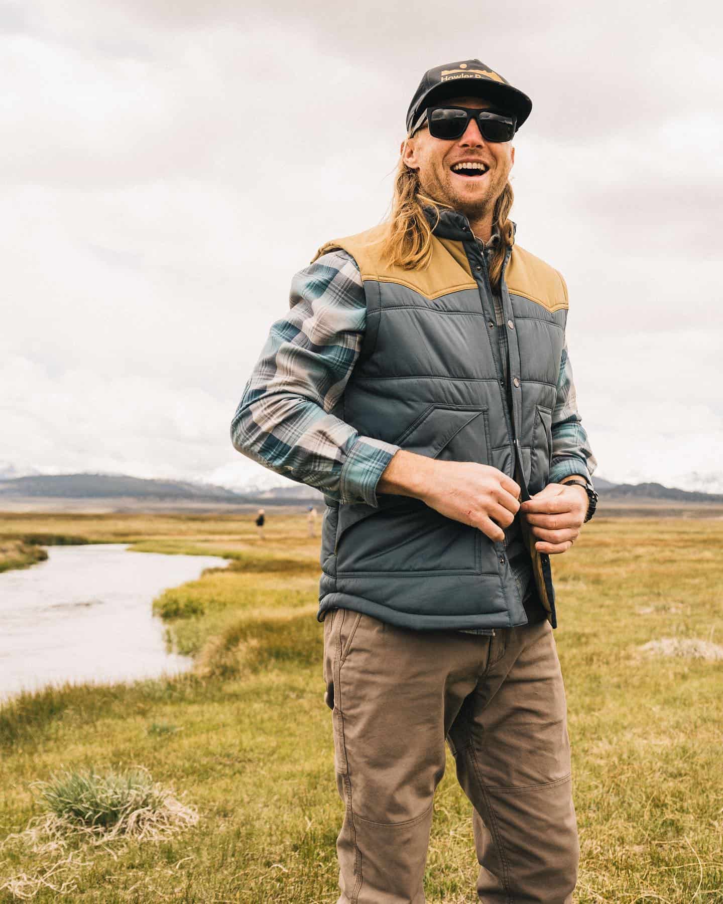 man wearing a rounder vest by howler bros