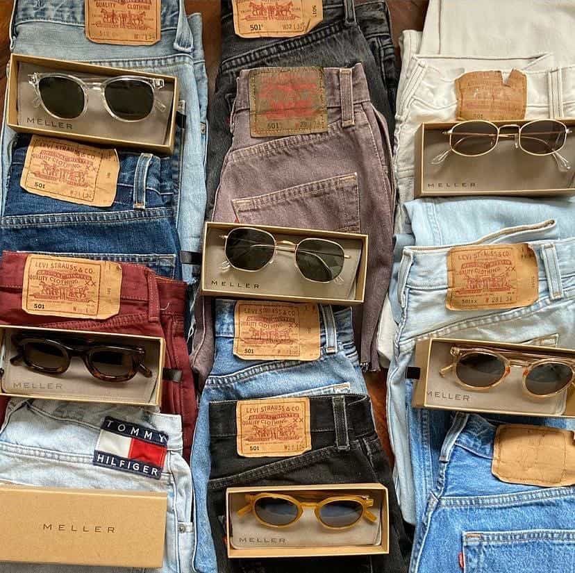 collection of jeans and sunglasses