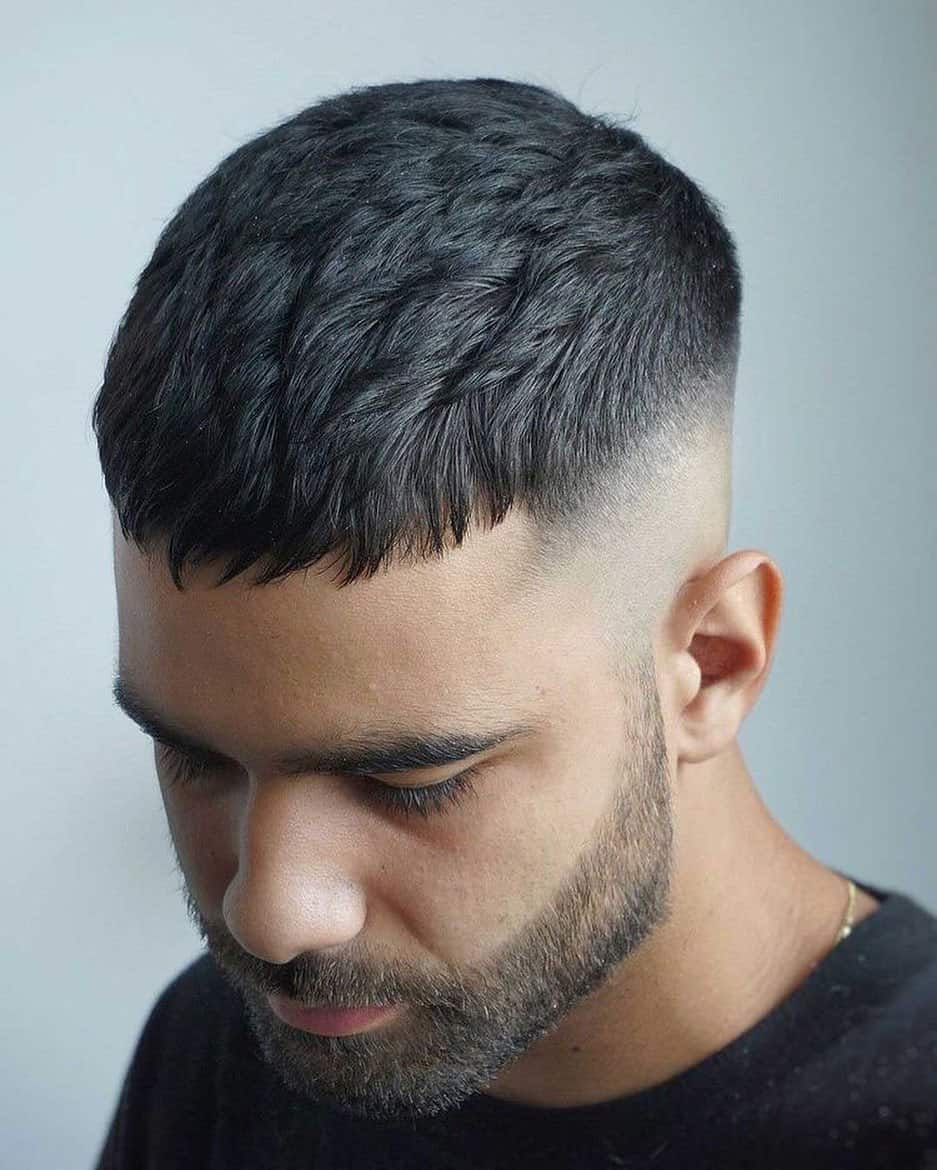 man with a taper fade haircut