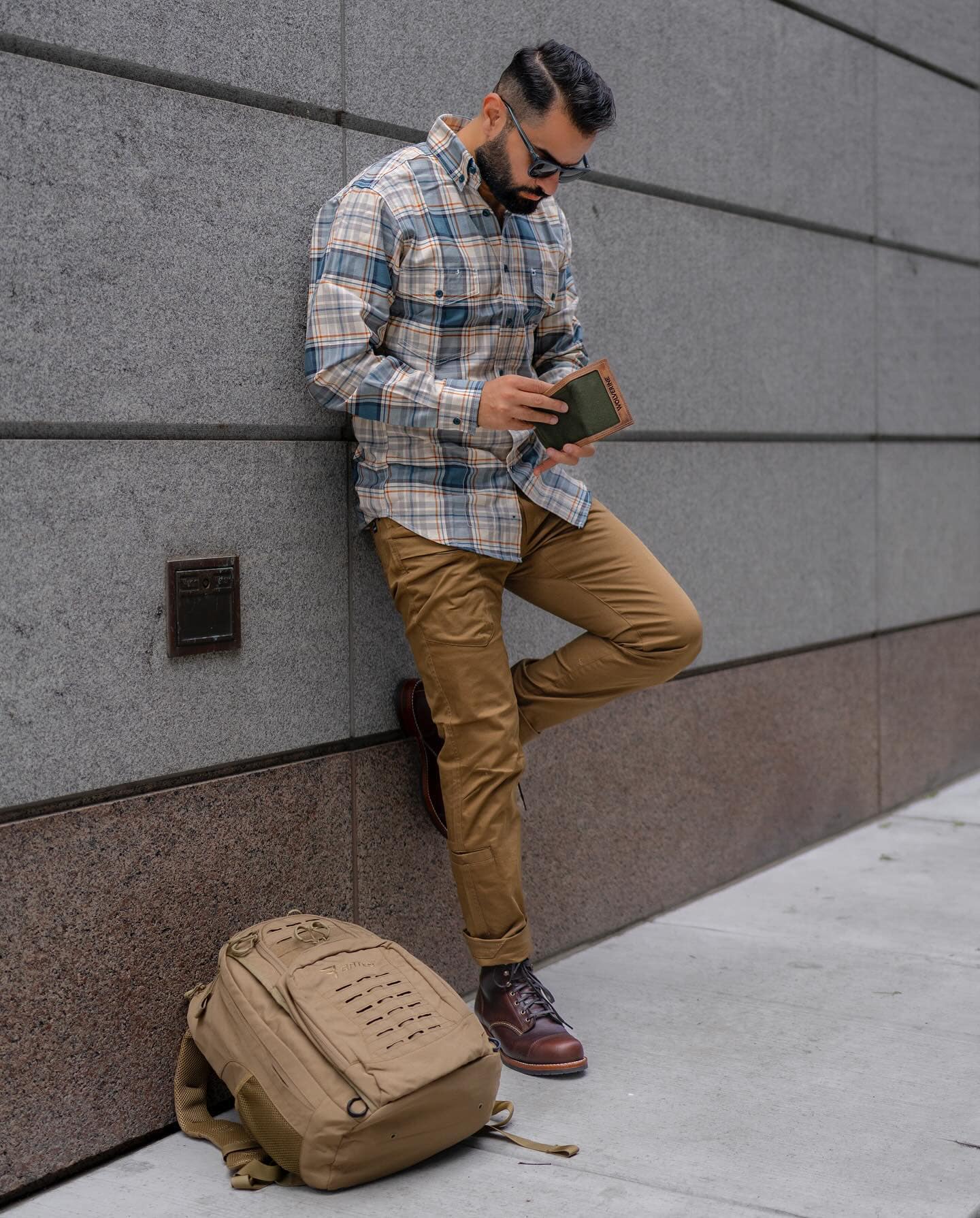 man checking the contents of a wallet