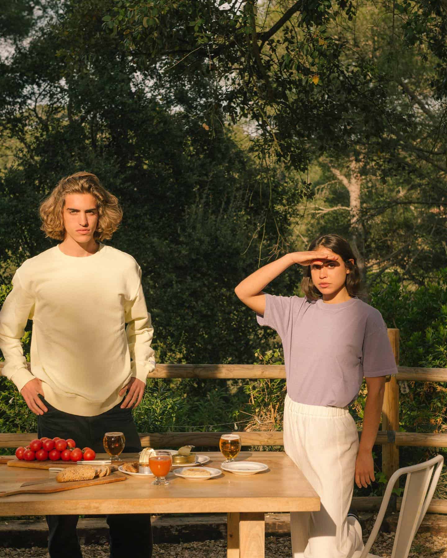 couple tanding beside a table with food