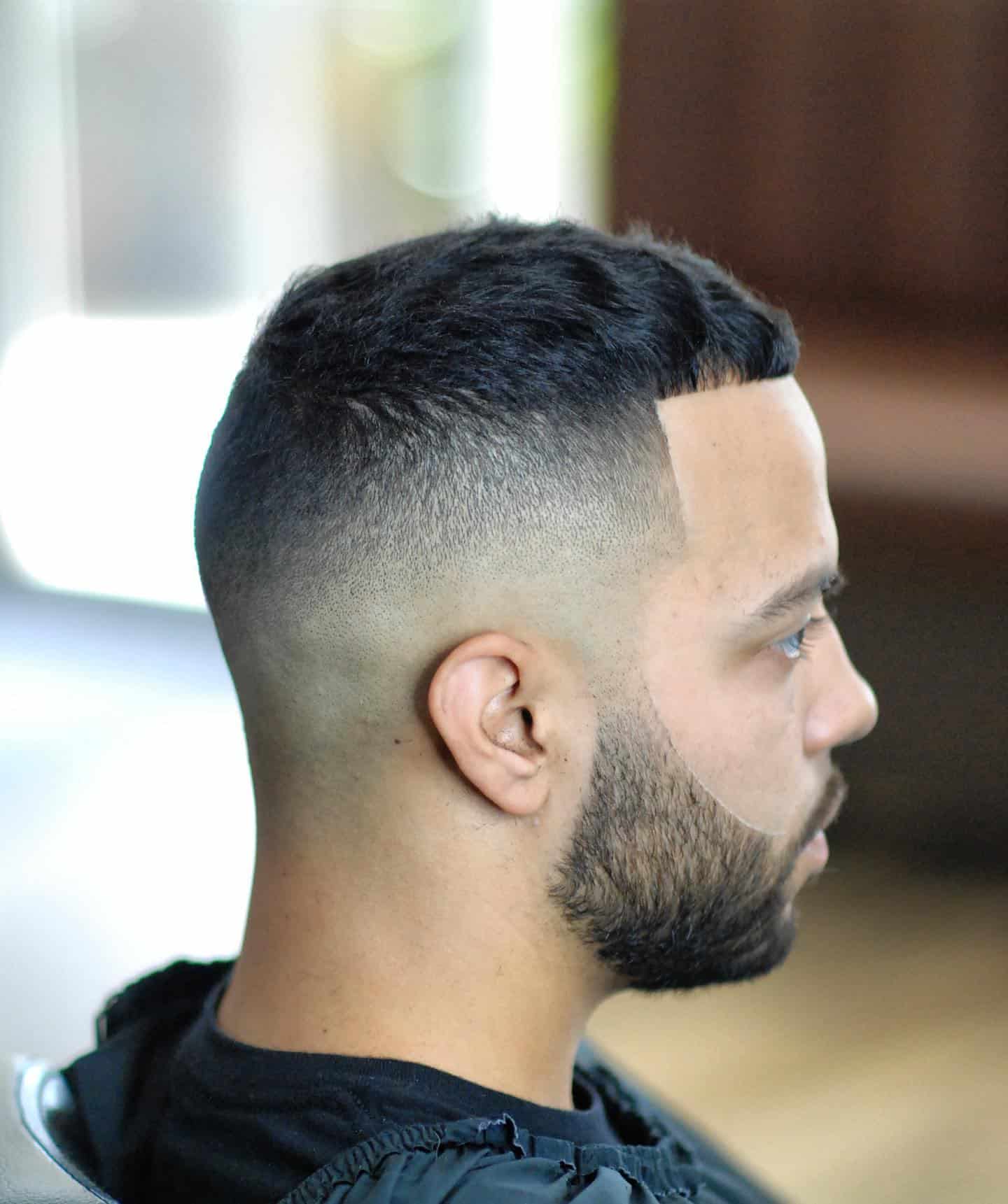 man with a fresh haircut and a trimmed beard