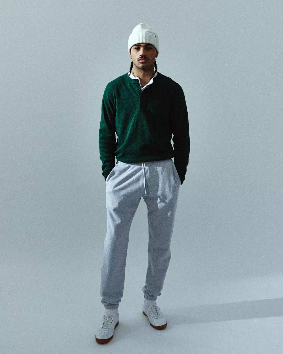 man with a beanie standing on one leg