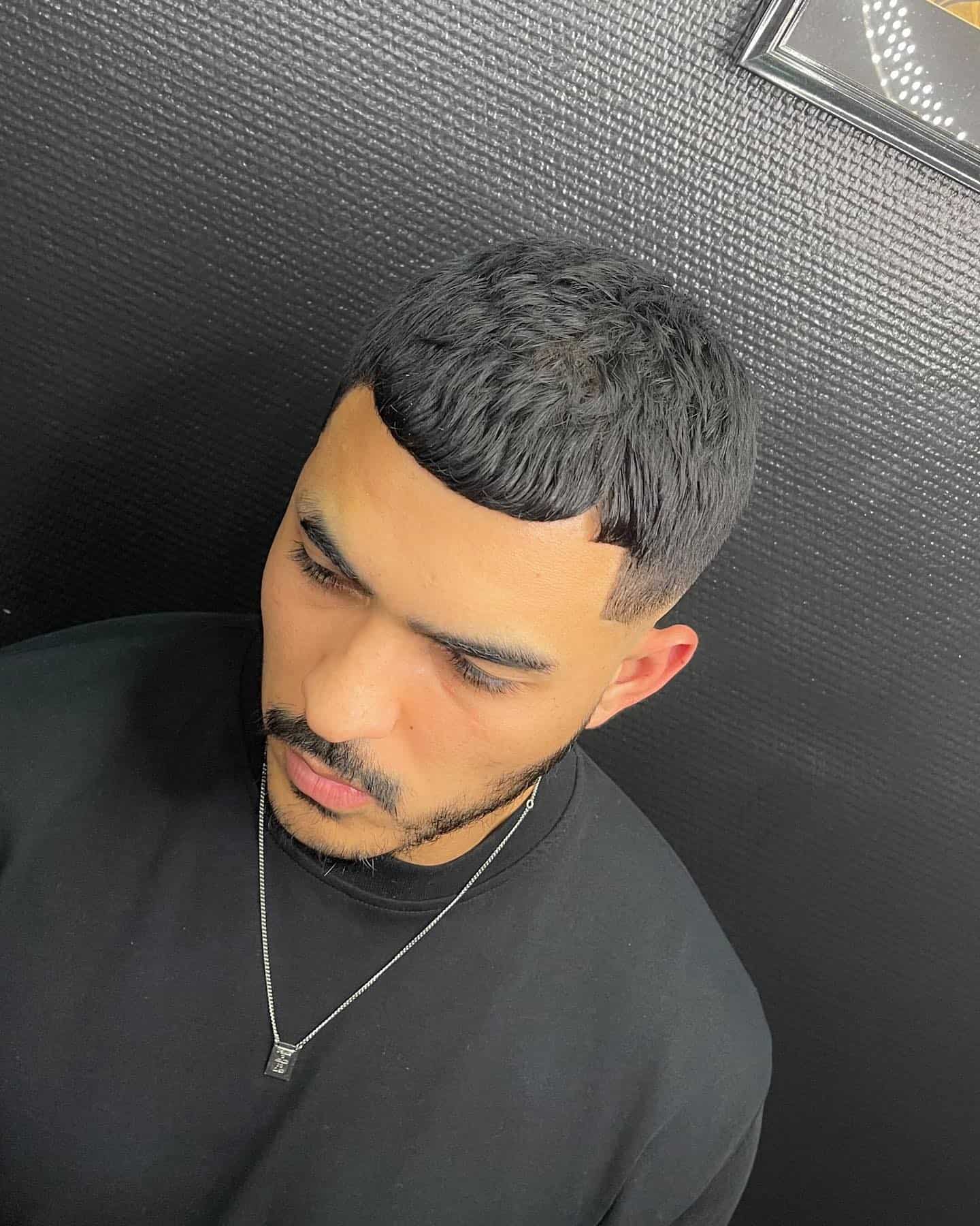 man with a bull hair haircut