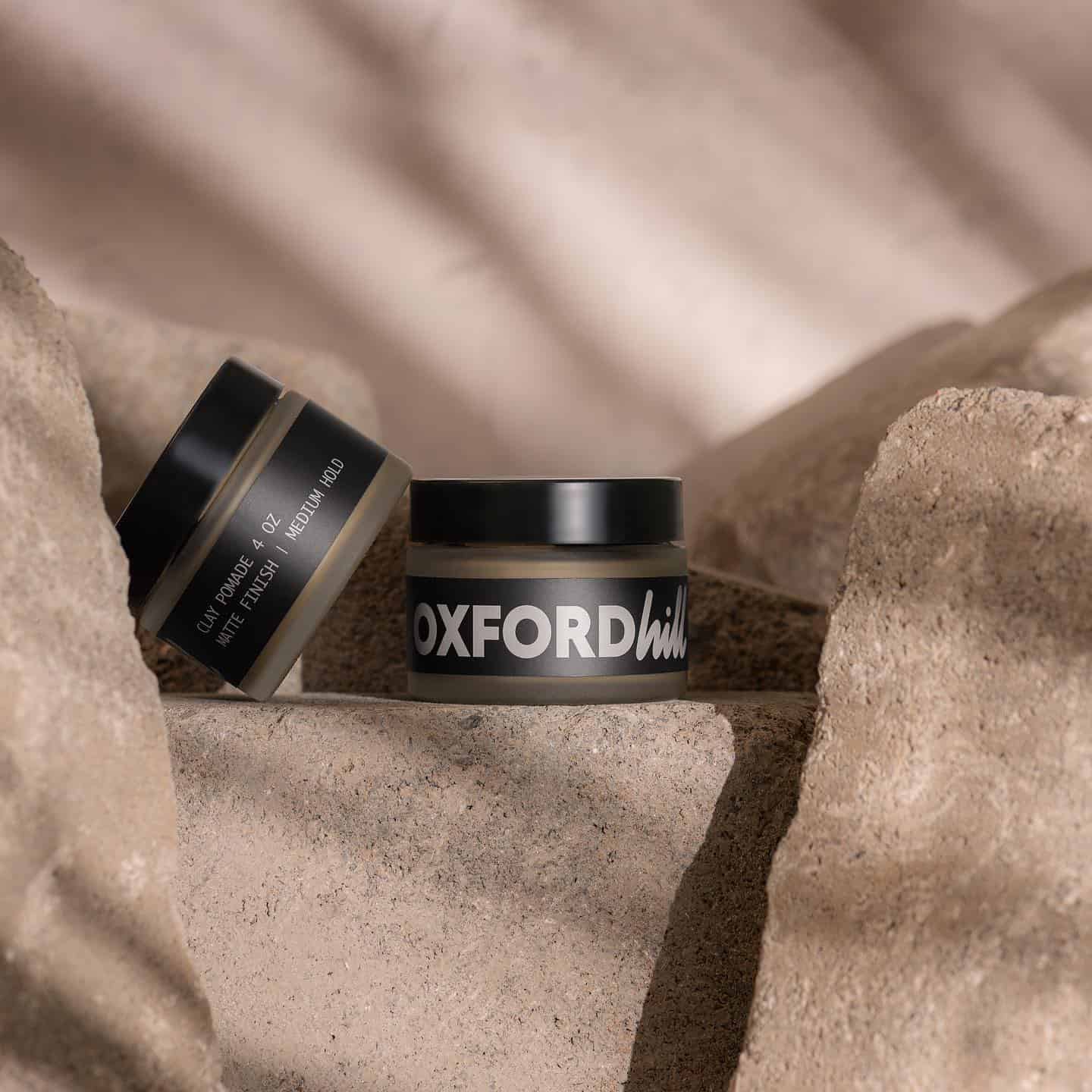 two bottles of oxford hill clay pomades