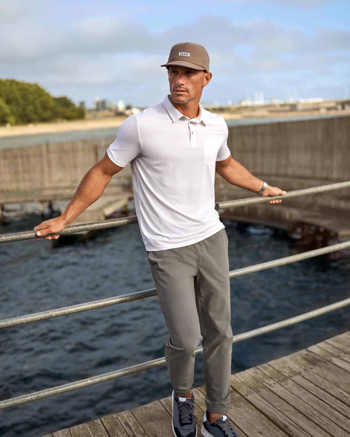 man leaning on a metal railing