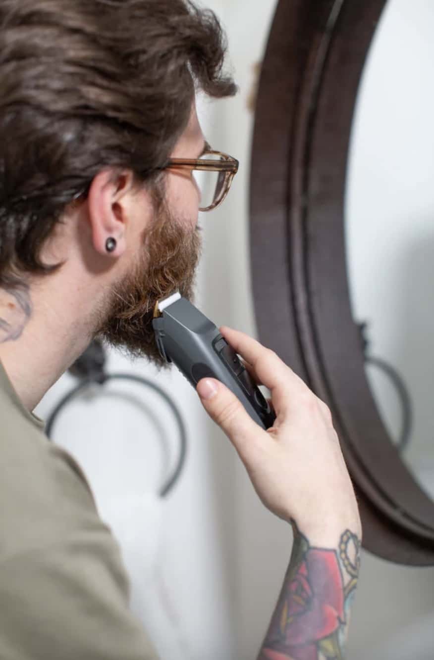 man using brio beardscape looking in mirror