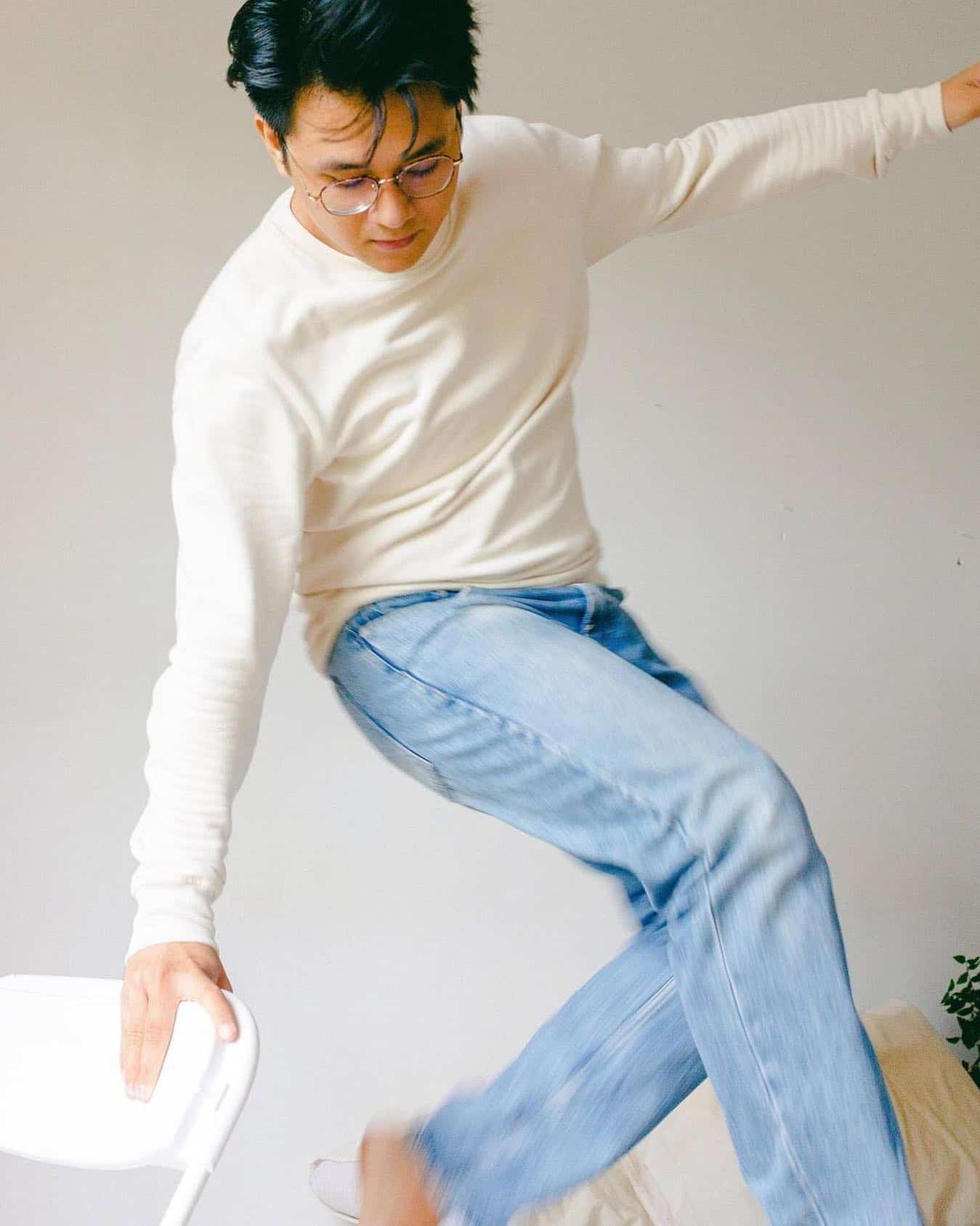man wearing an off-white sweater