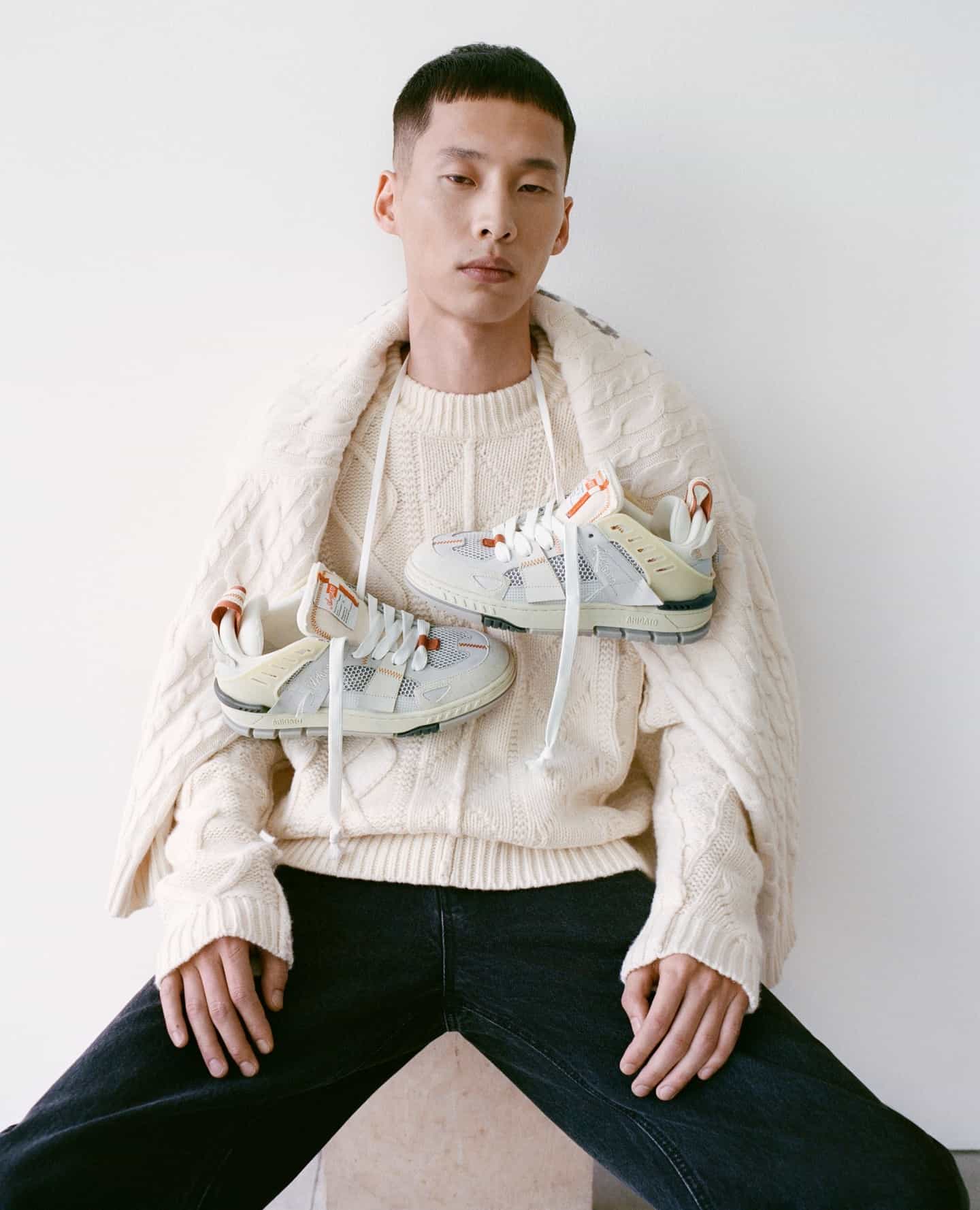 hanging a pair of sneakers on the neck