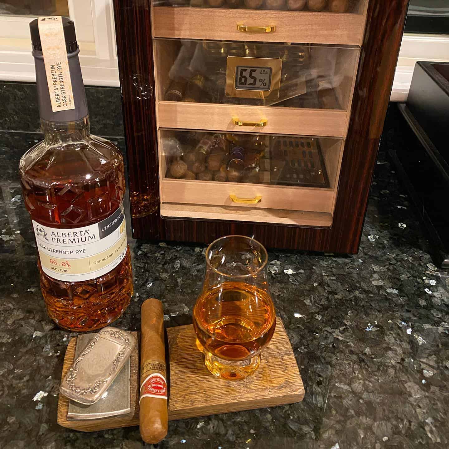 having a glass of rye and a cigar