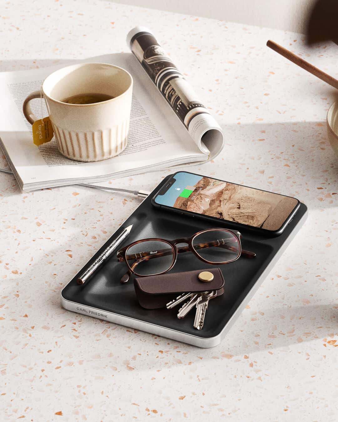 a charging tray by carl friedrik