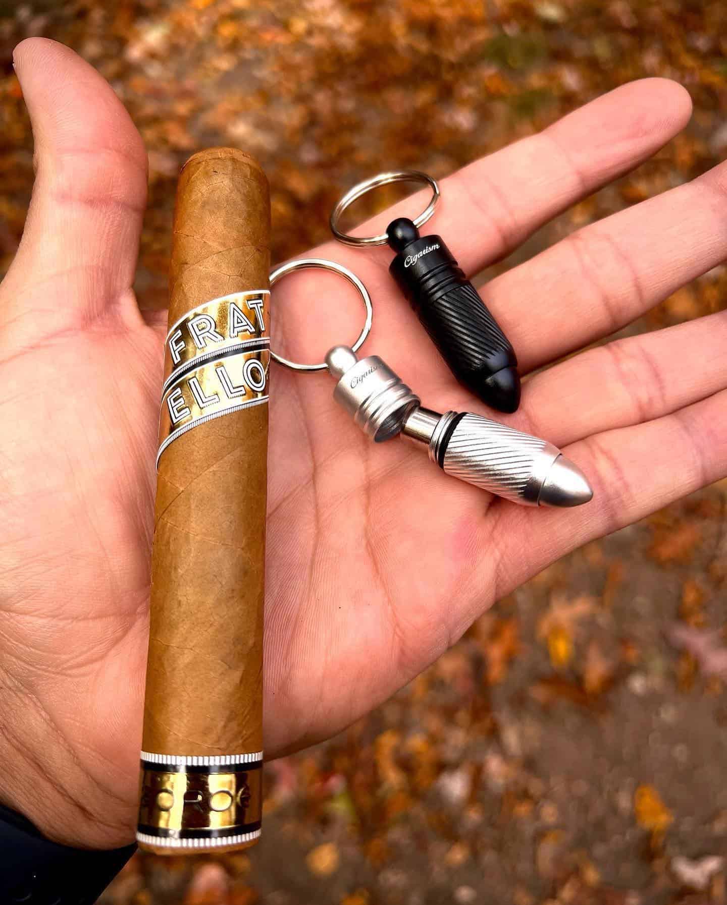 holding a cigar and cigar punchers