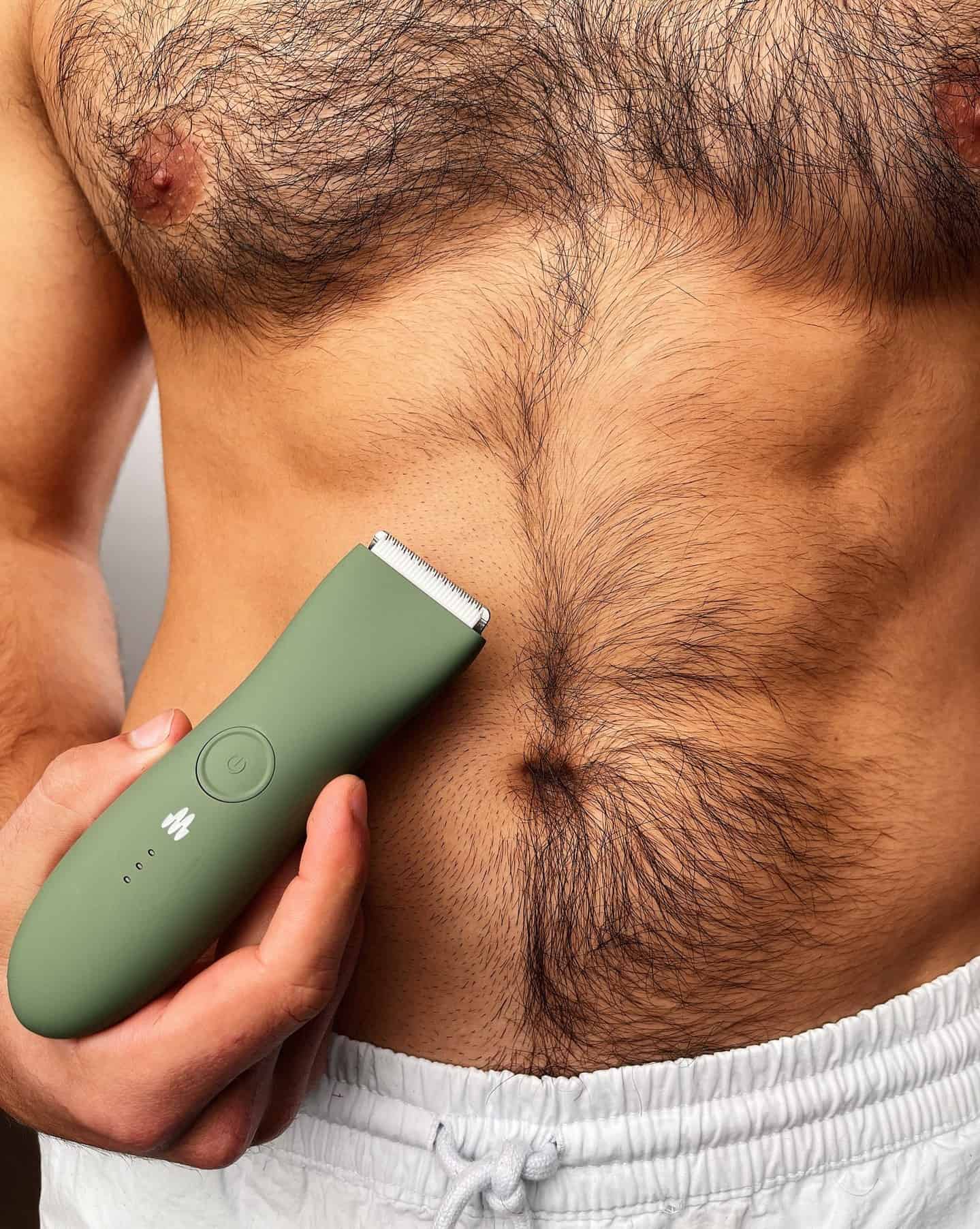 trimming excess body hair with meridian trimmer