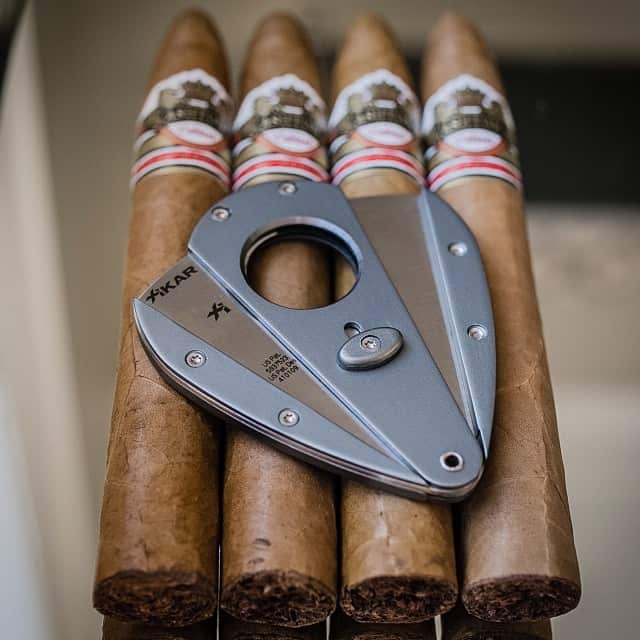 xikar cigar cuttar on top of cigars