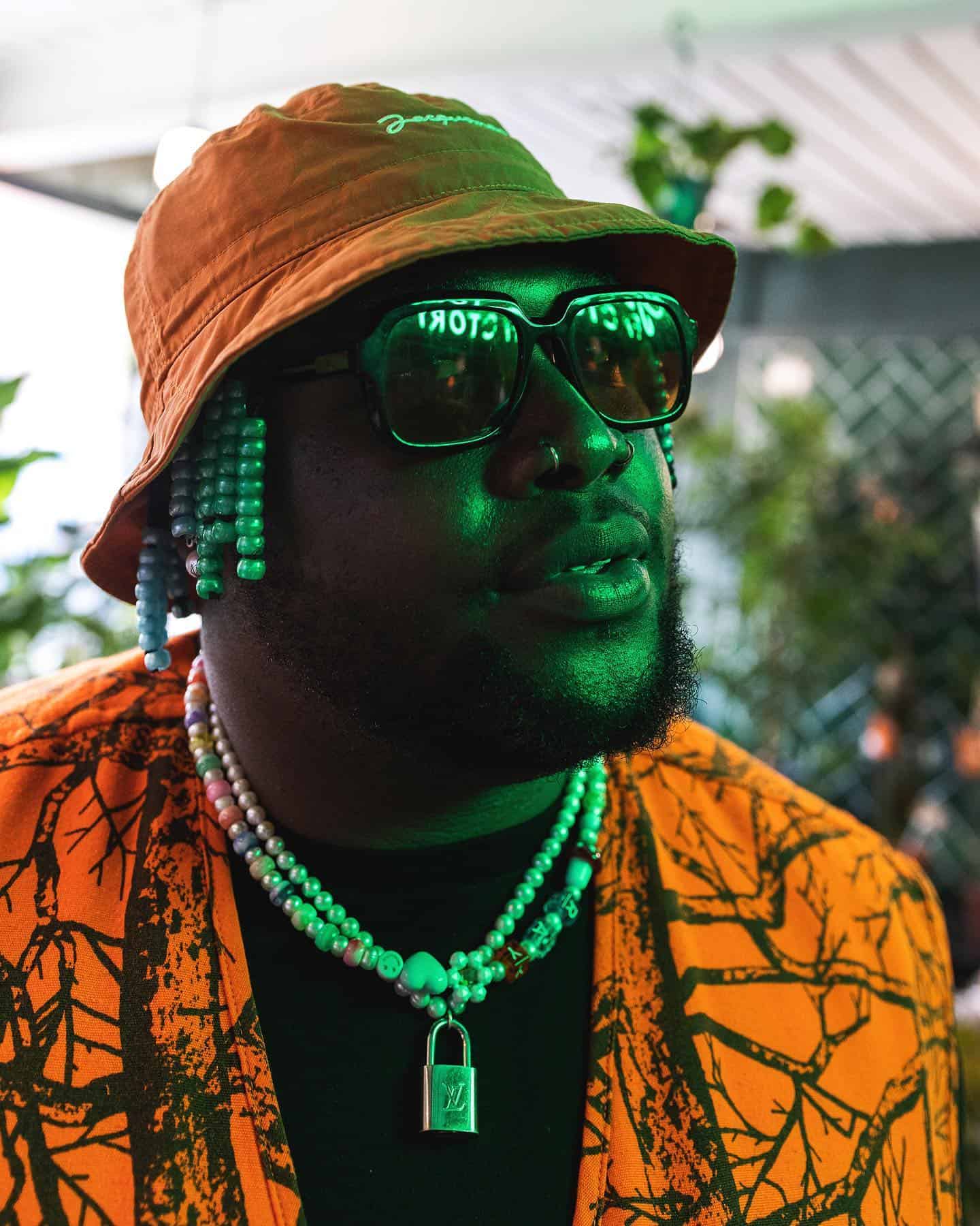 man wearing a bucket hat and sunglasses