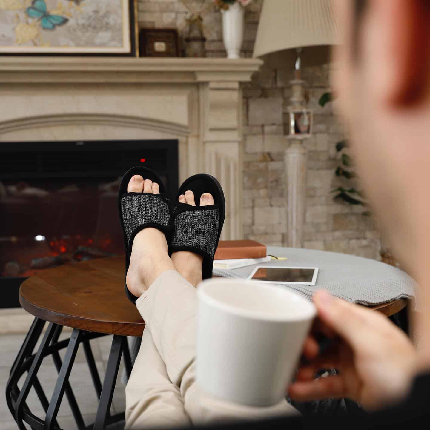 man resting feet on top of a center table