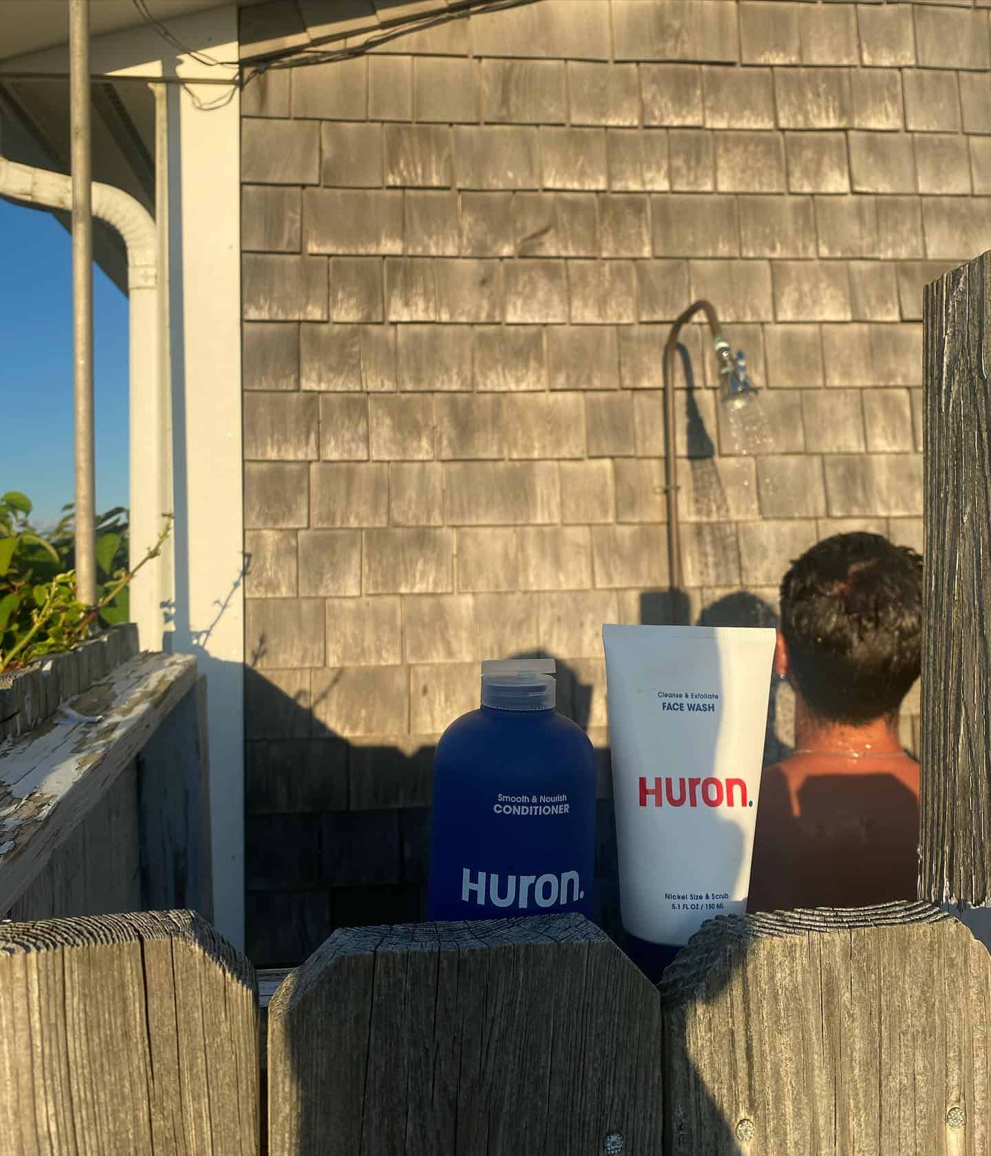 man taking a shower outdoors