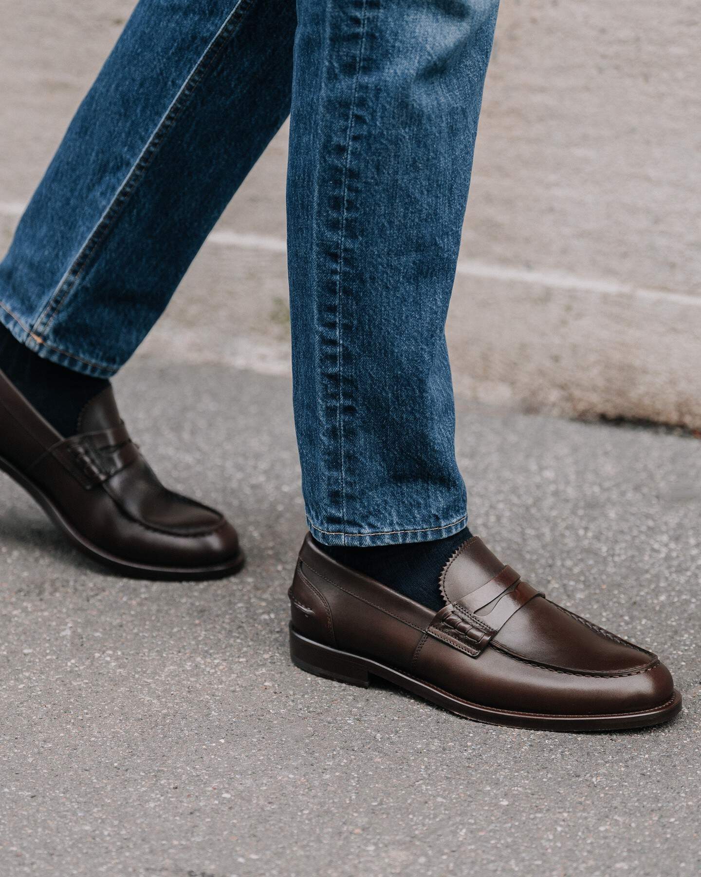 wearing a pair of brown penny loafers