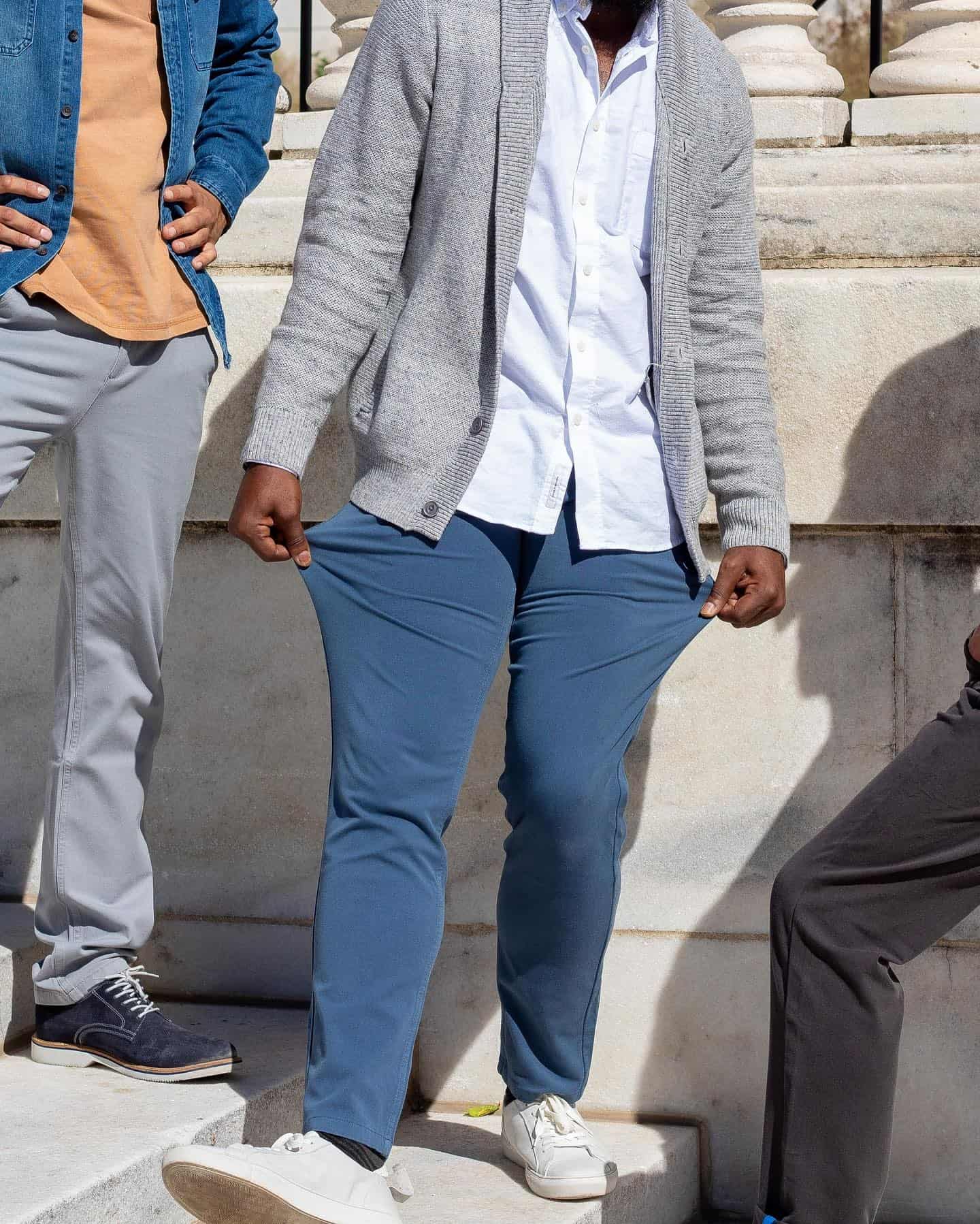 Man pulling on Mugsy Chino pants to show stretch
